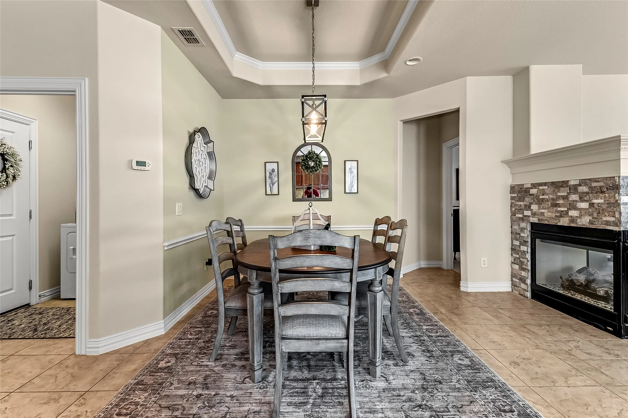 Dining with view of fireplace