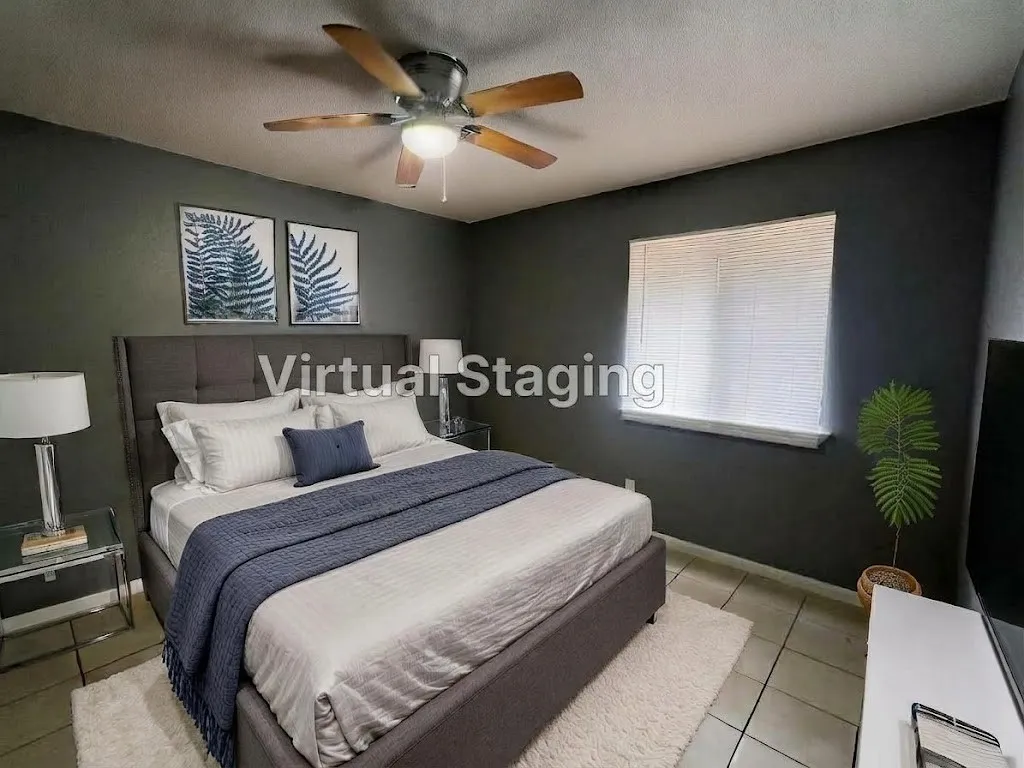 Ceiling fan with light fixture, window with blinds, tile flooring, and dark-painted walls