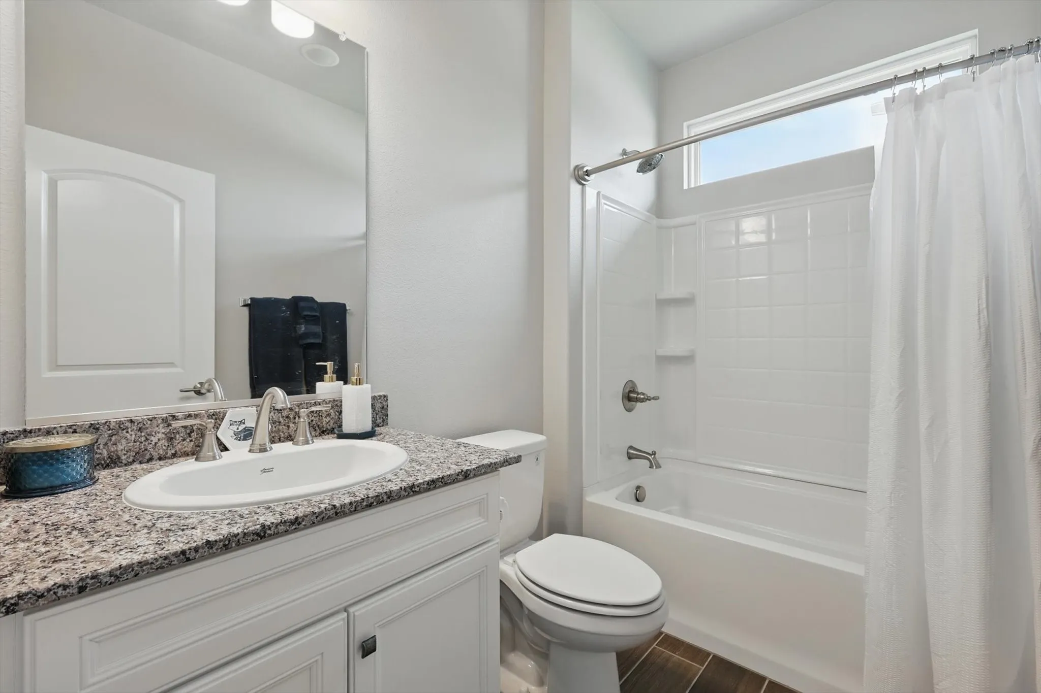 Full guest bath with shower / bath combination .