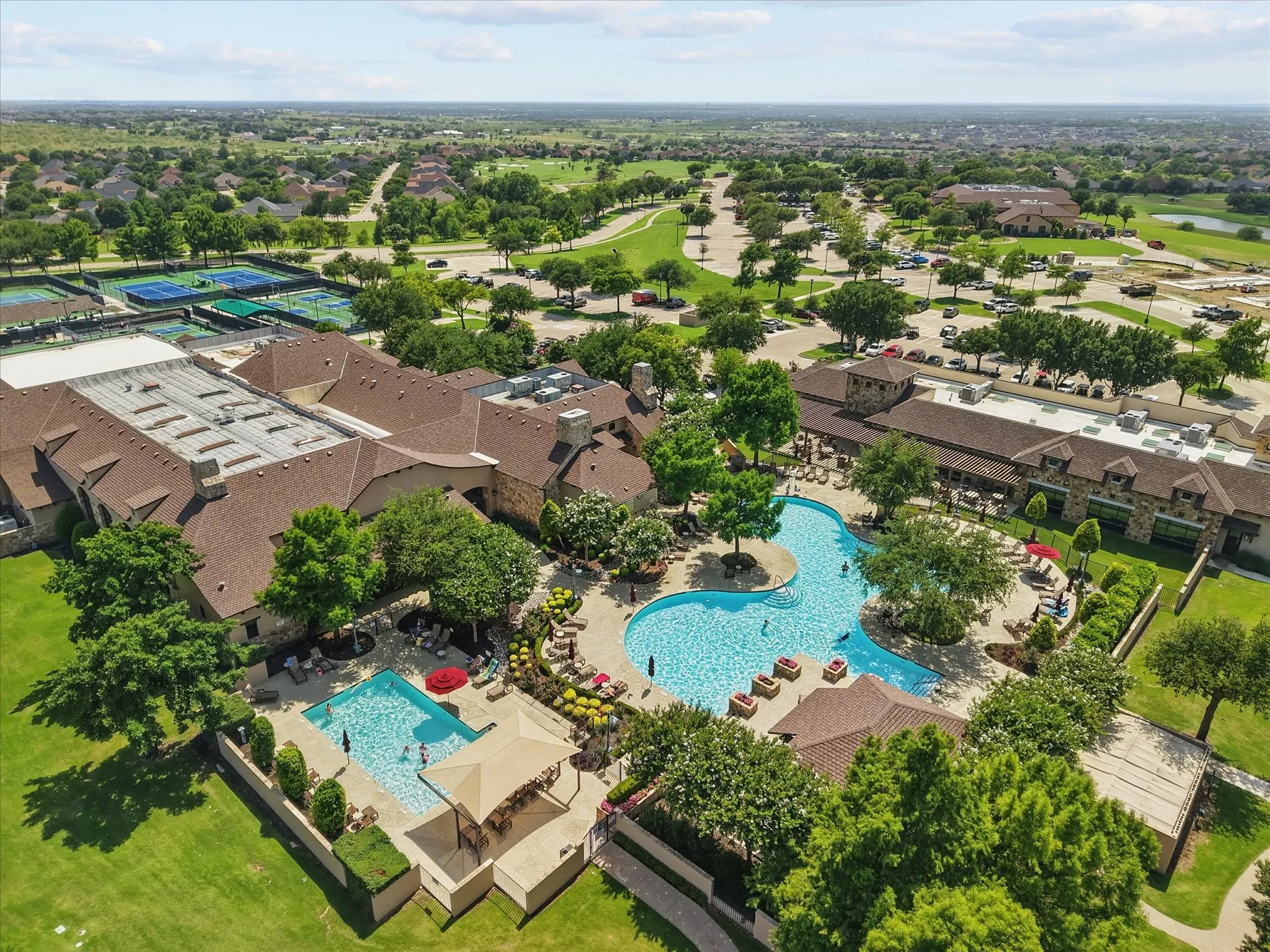 Aerial perspective of Cimmaron Sports Center with resort-style pool.