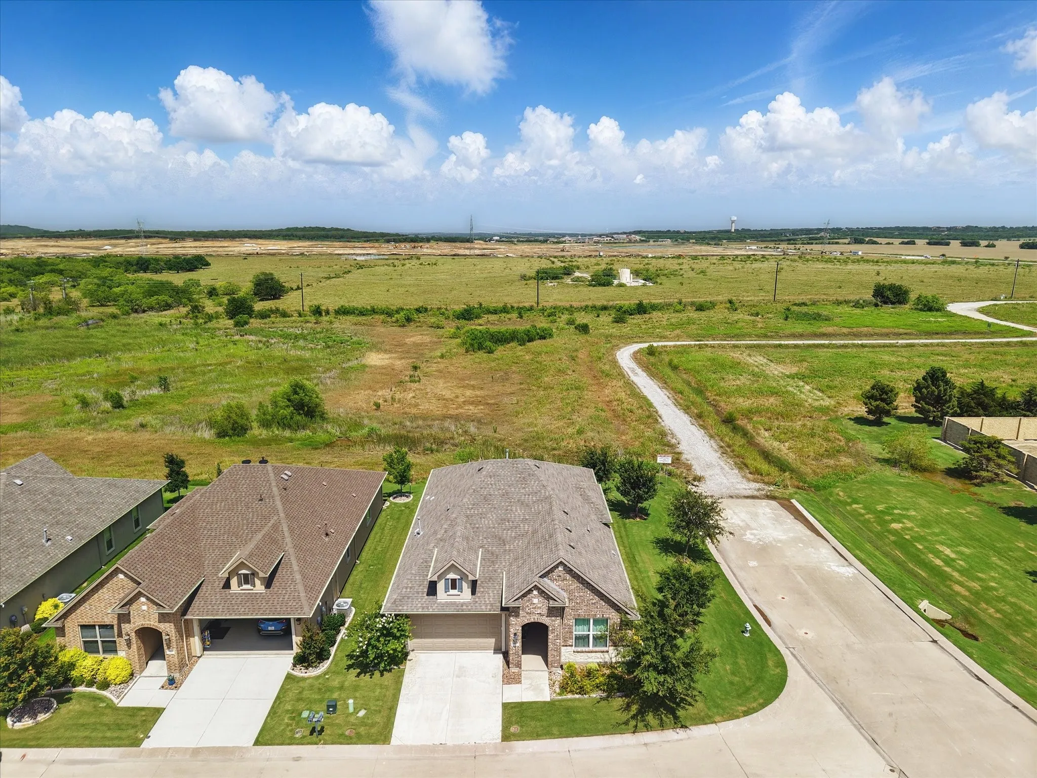 Aerial view of corner lot on quiet street.