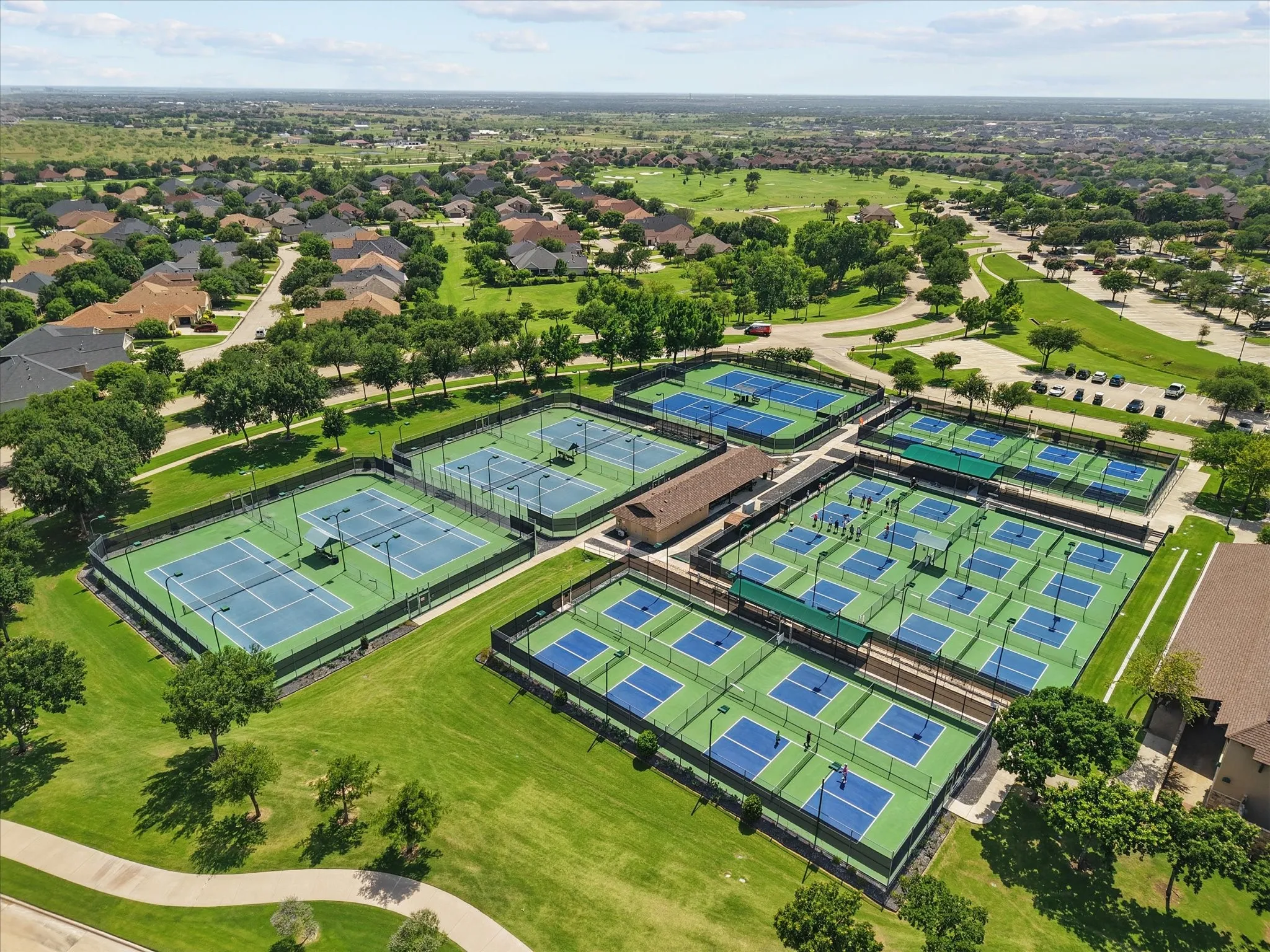 Drone / aerial view of pickleball and tennis courts.