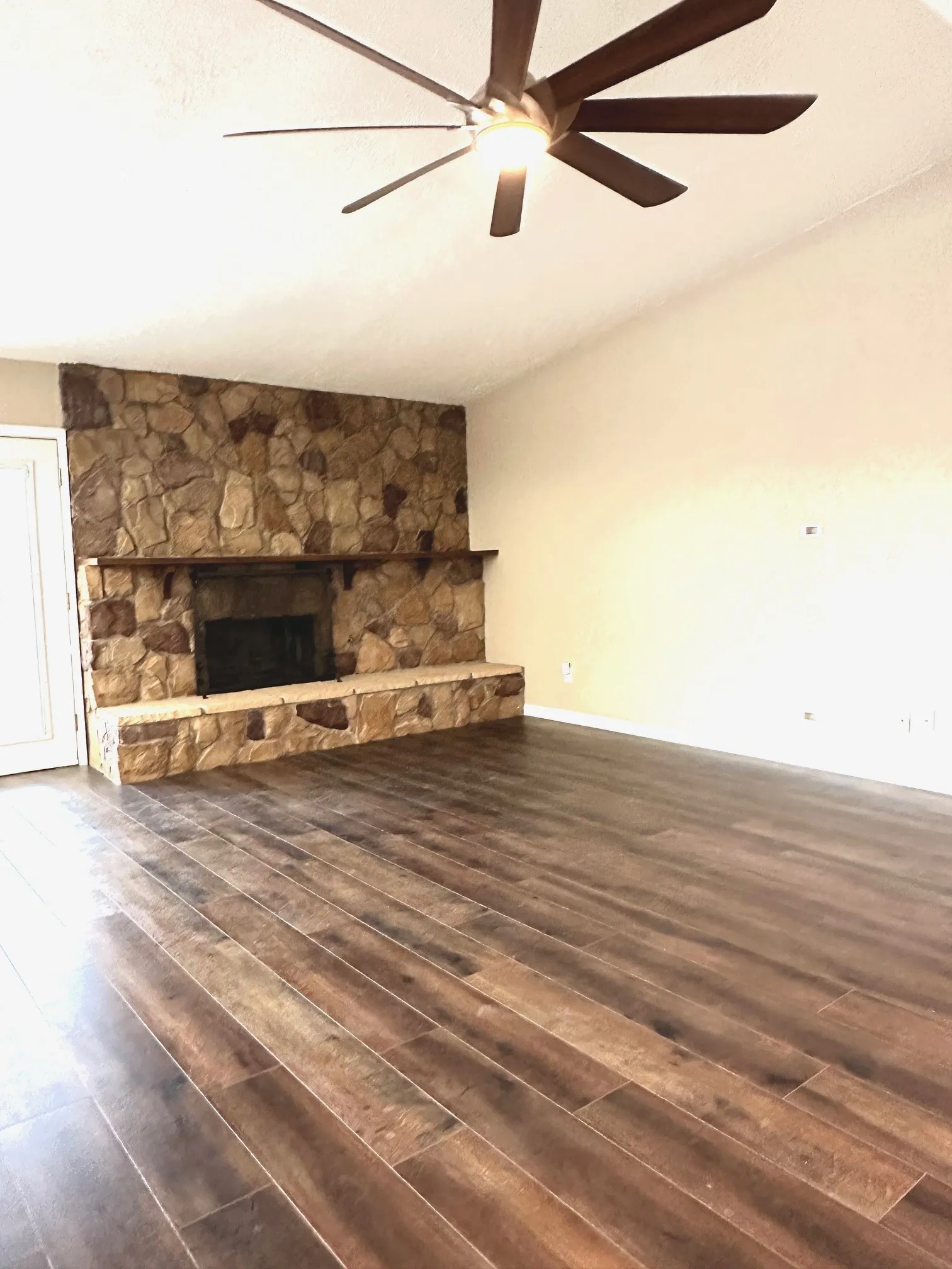 Large family room with designer fan