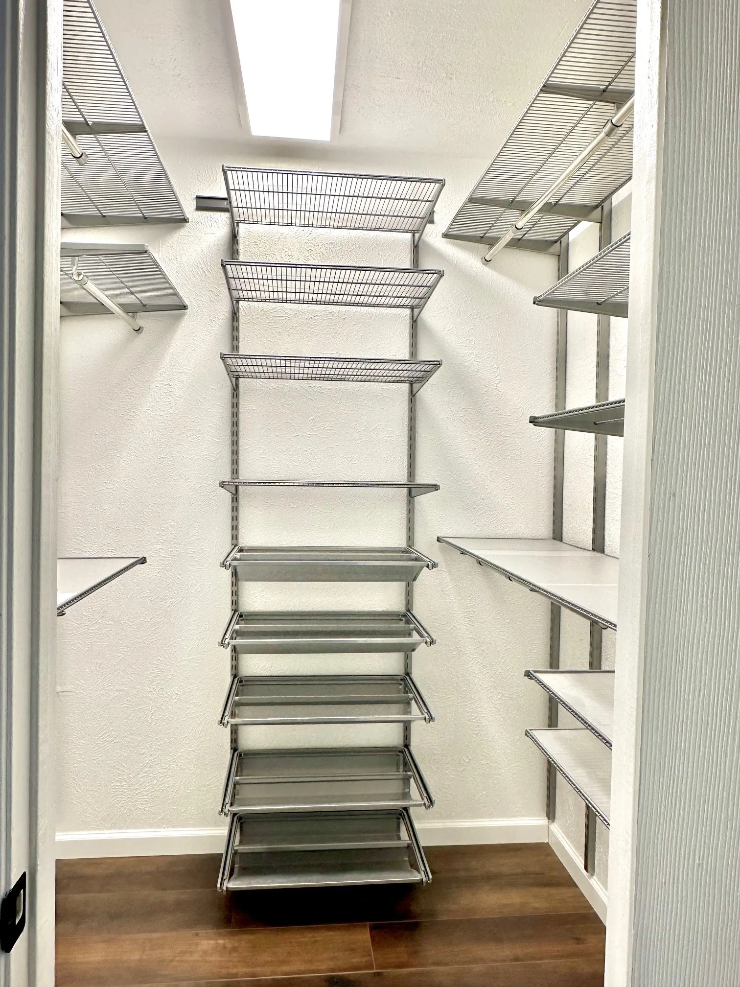 Primary's walk-in-closet with custom organization