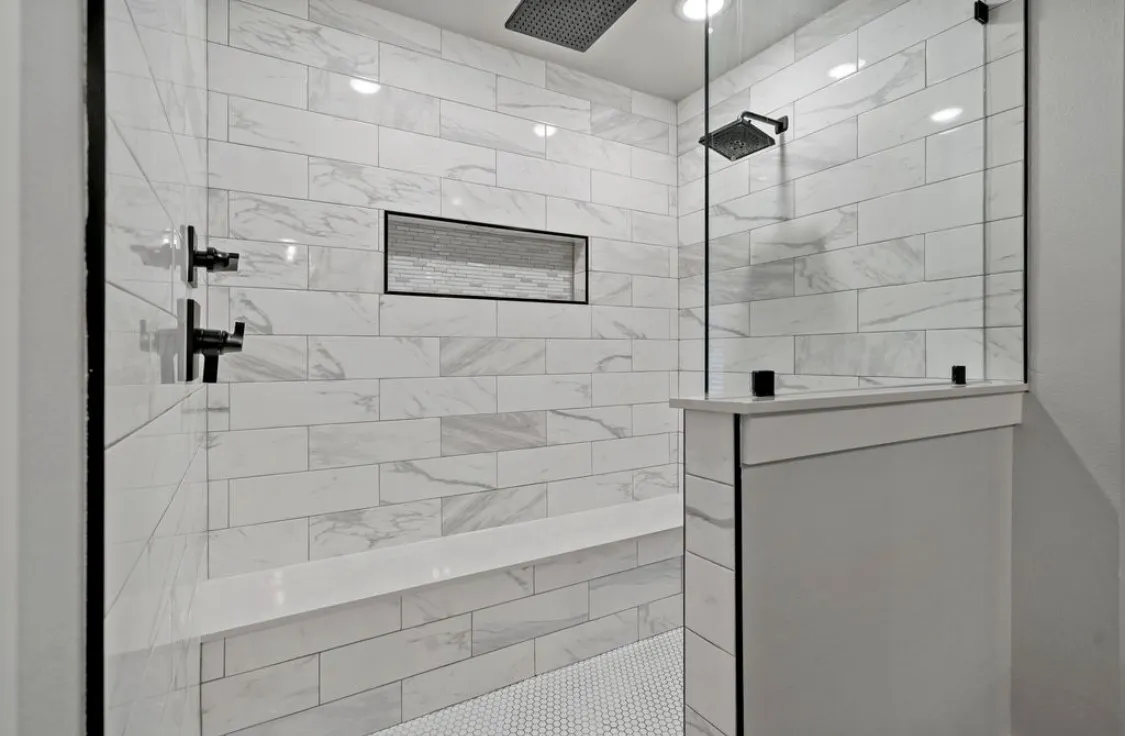 Bathroom with ceiling fan and walk in shower