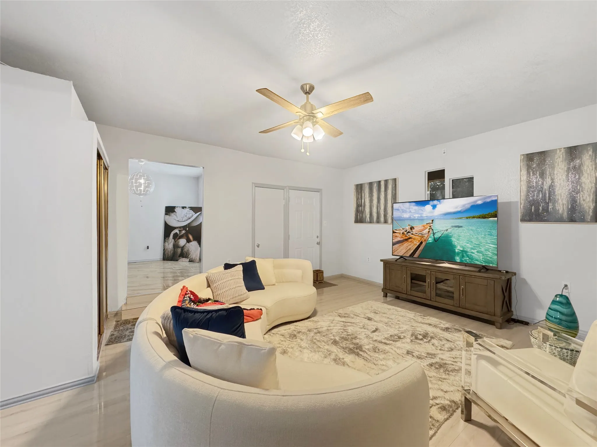 Recessed lighting, ceiling fan with light fixture, light-toned tile flooring, and white walls