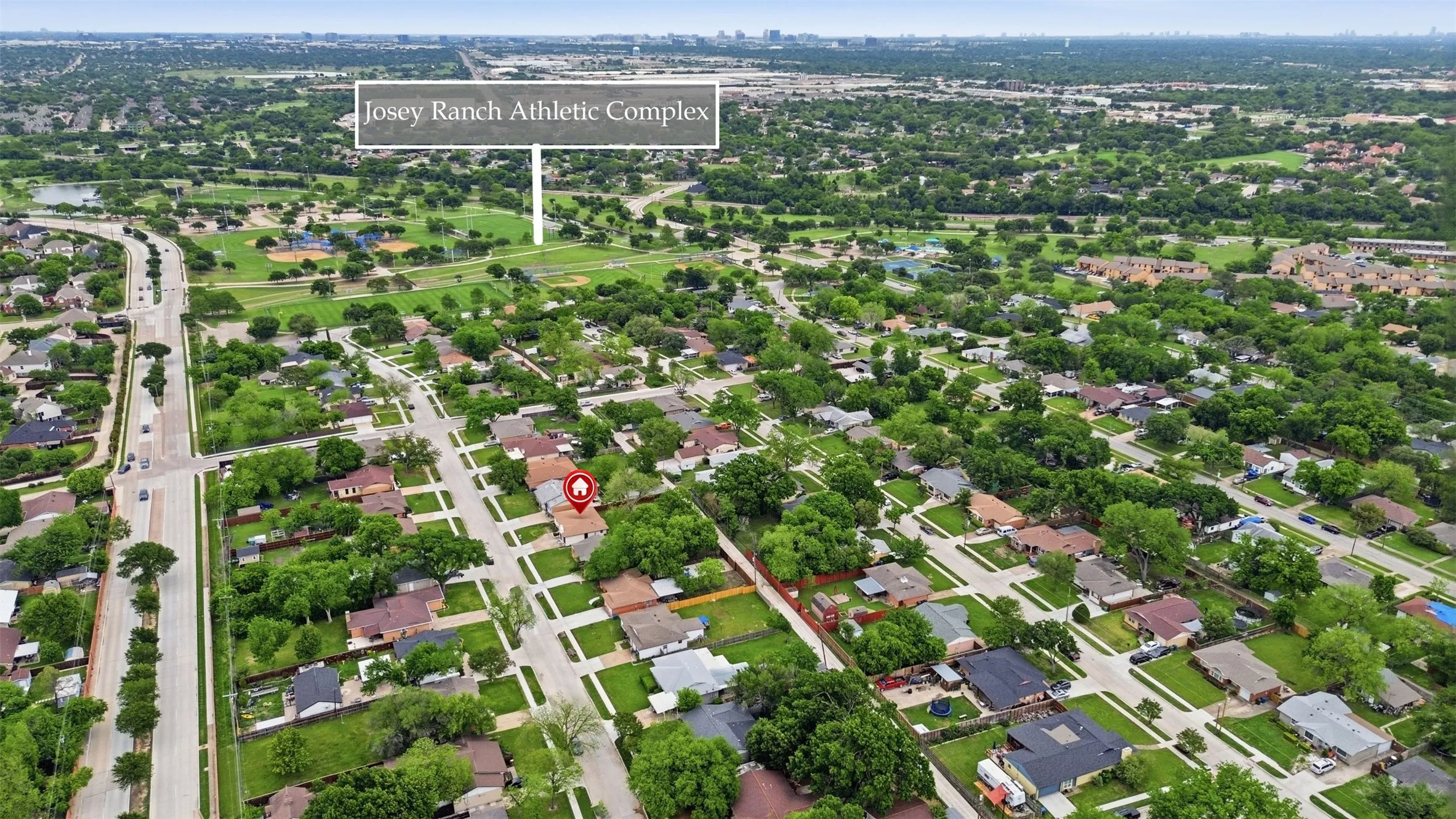 Aerial perspective of a residential neighborhood with mature trees