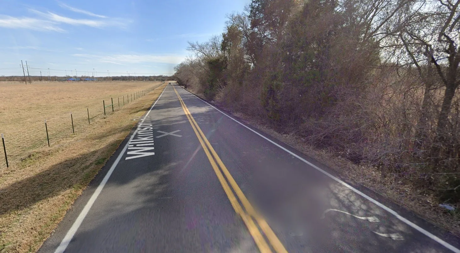 View of asphalt road featuring a view of countryside