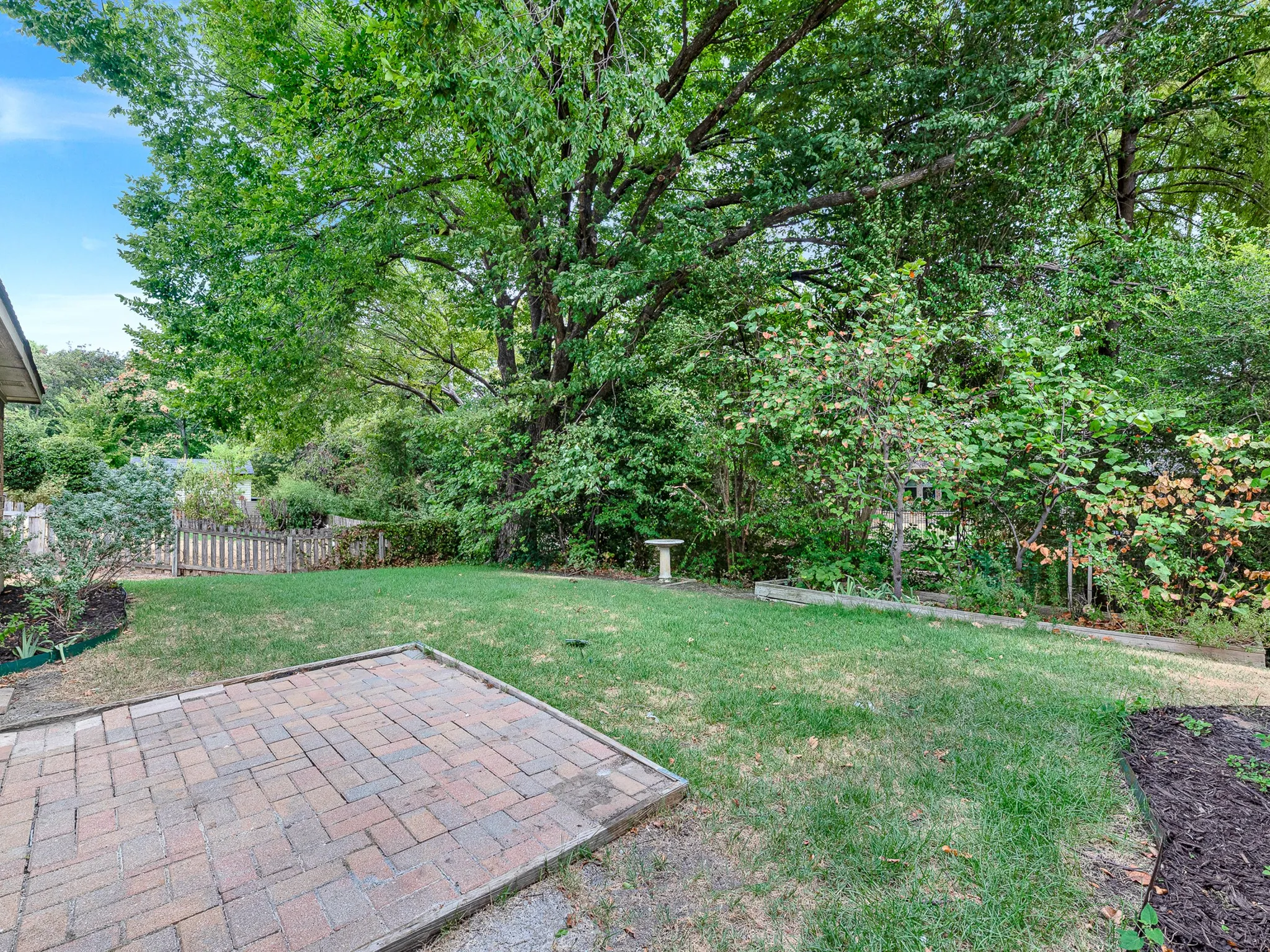 The backyard is private and backs to a very small creek