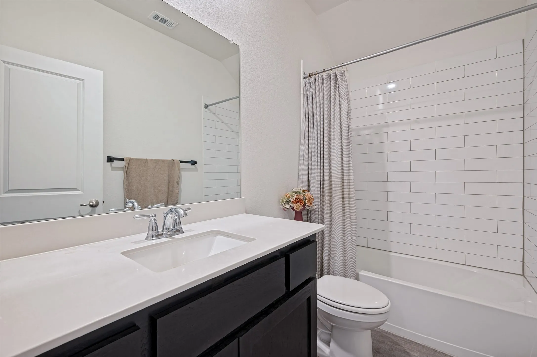 Integrated vanity with an undermount sink, chrome faucet, and expansive countertop