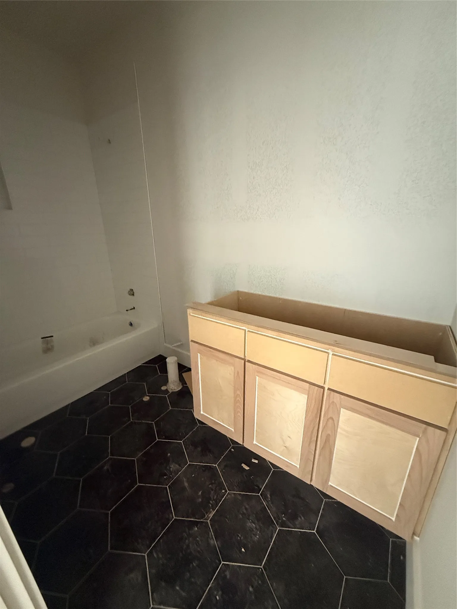 Downstairs guest bedroom with octagon tiled floors