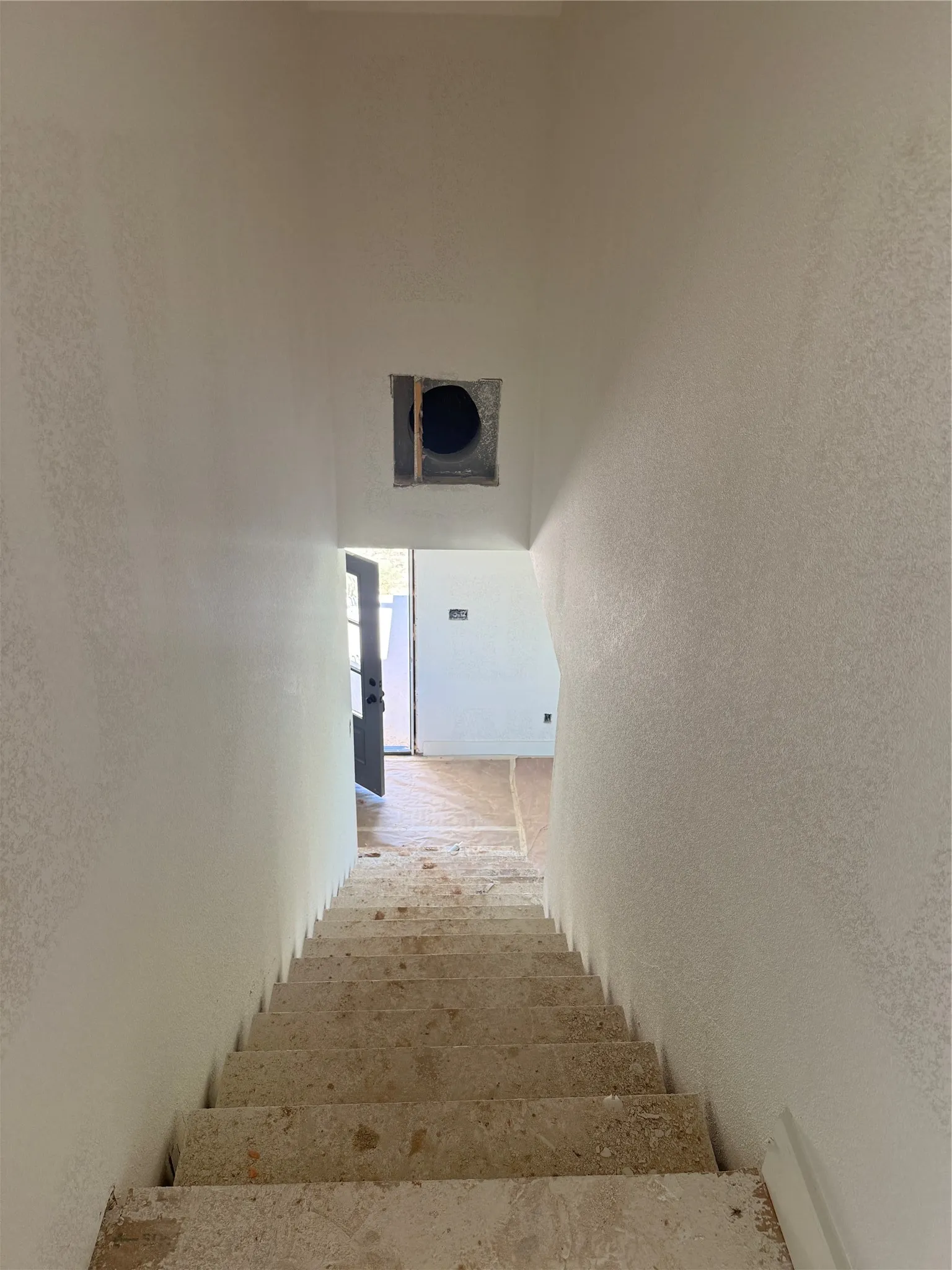 Stairs looking down at front door