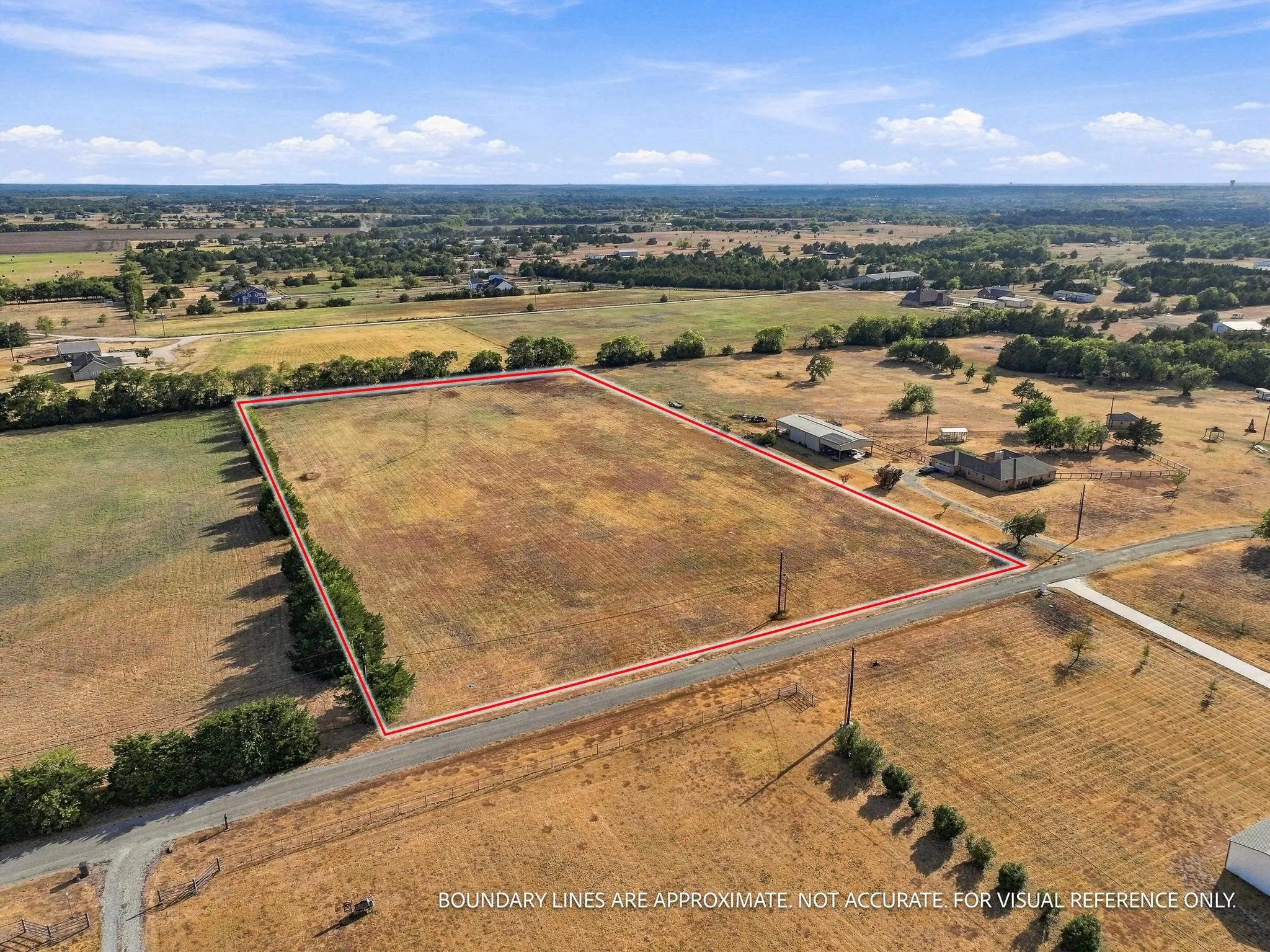 Expansive land parcel featuring clear boundaries, direct road access, and surrounding natural landscapes