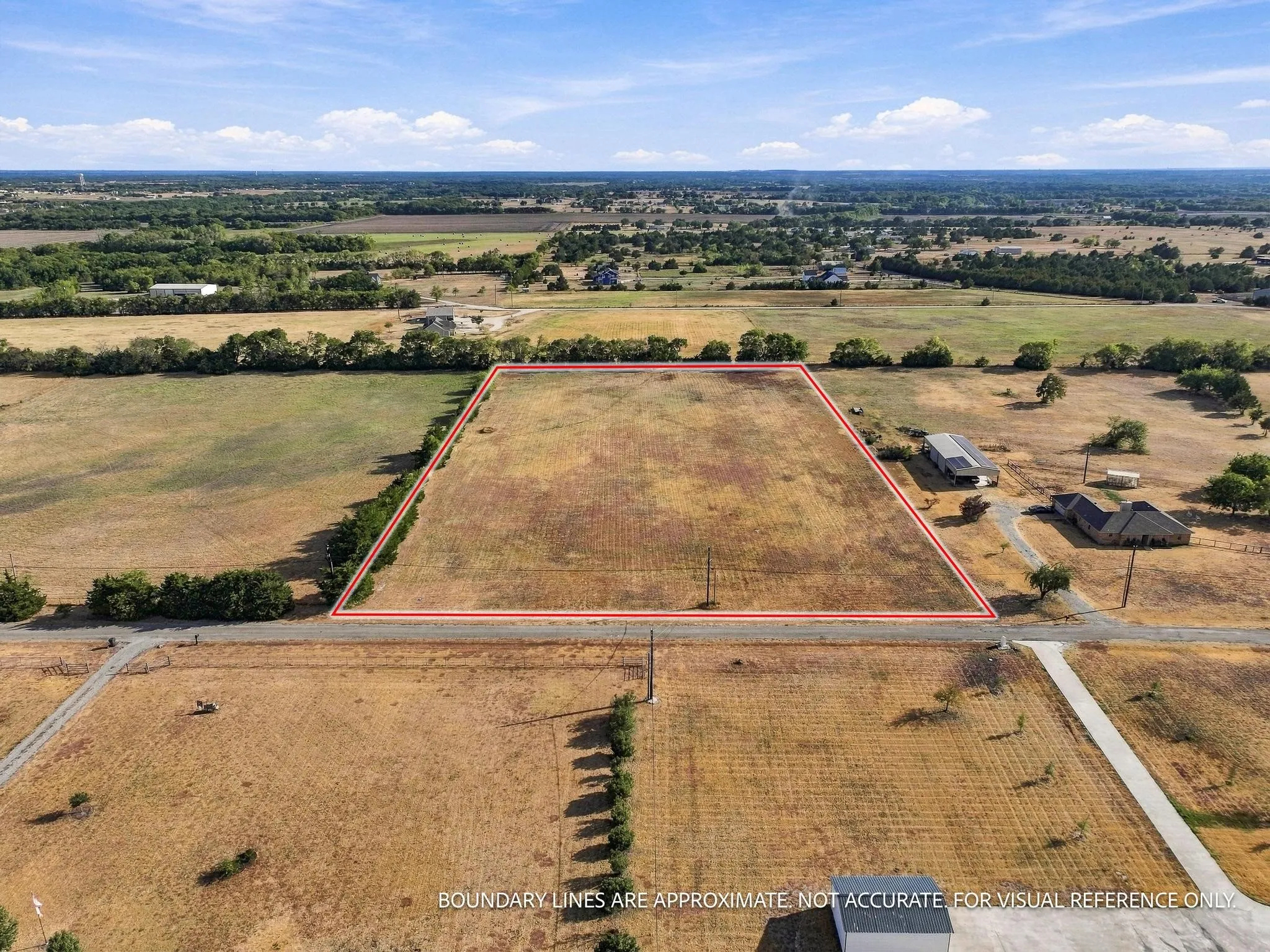 Expansive land parcel with surrounding agricultural fields