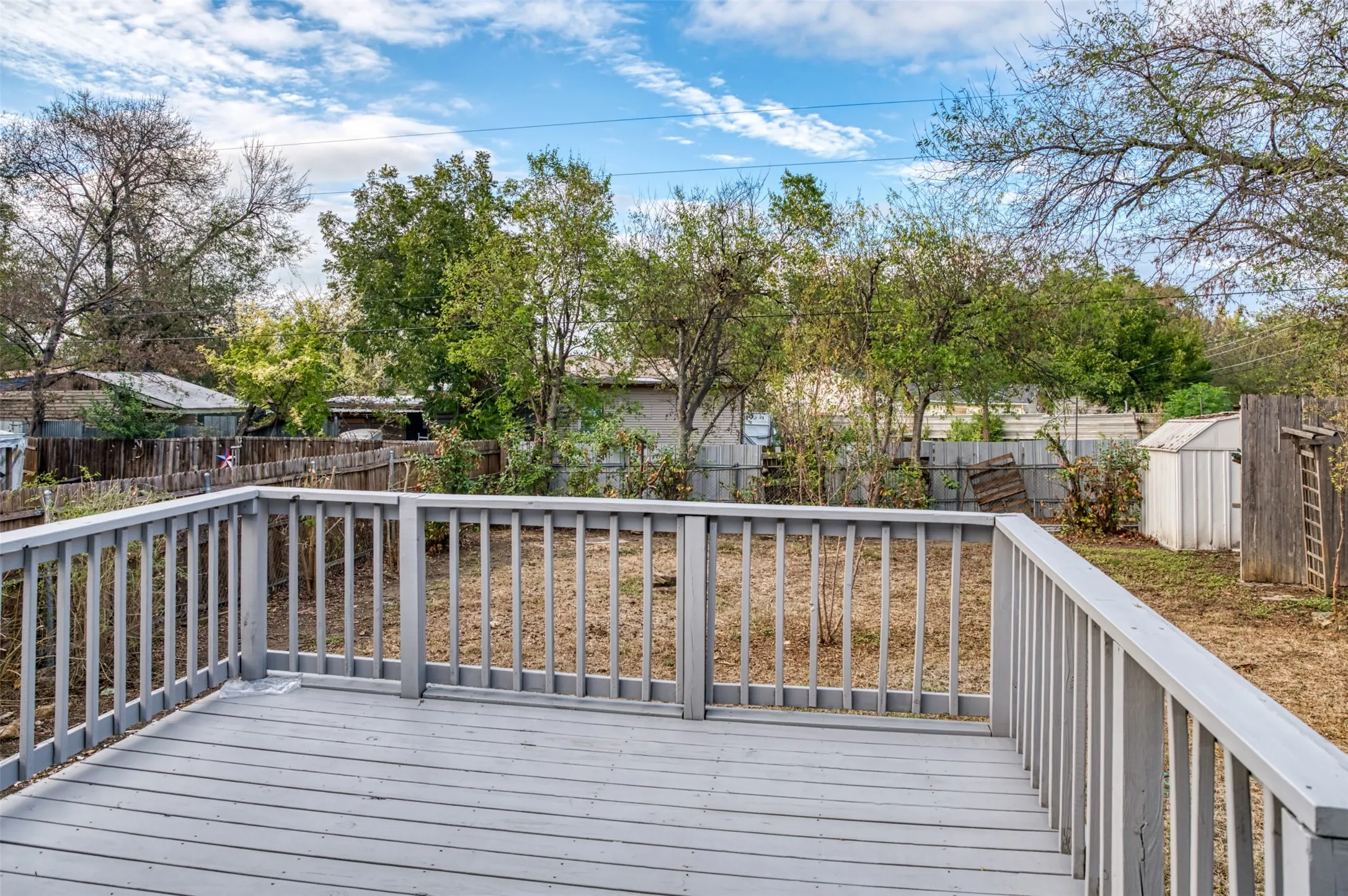 Nice sized deck elevated above the yard provides a great space for cookouts