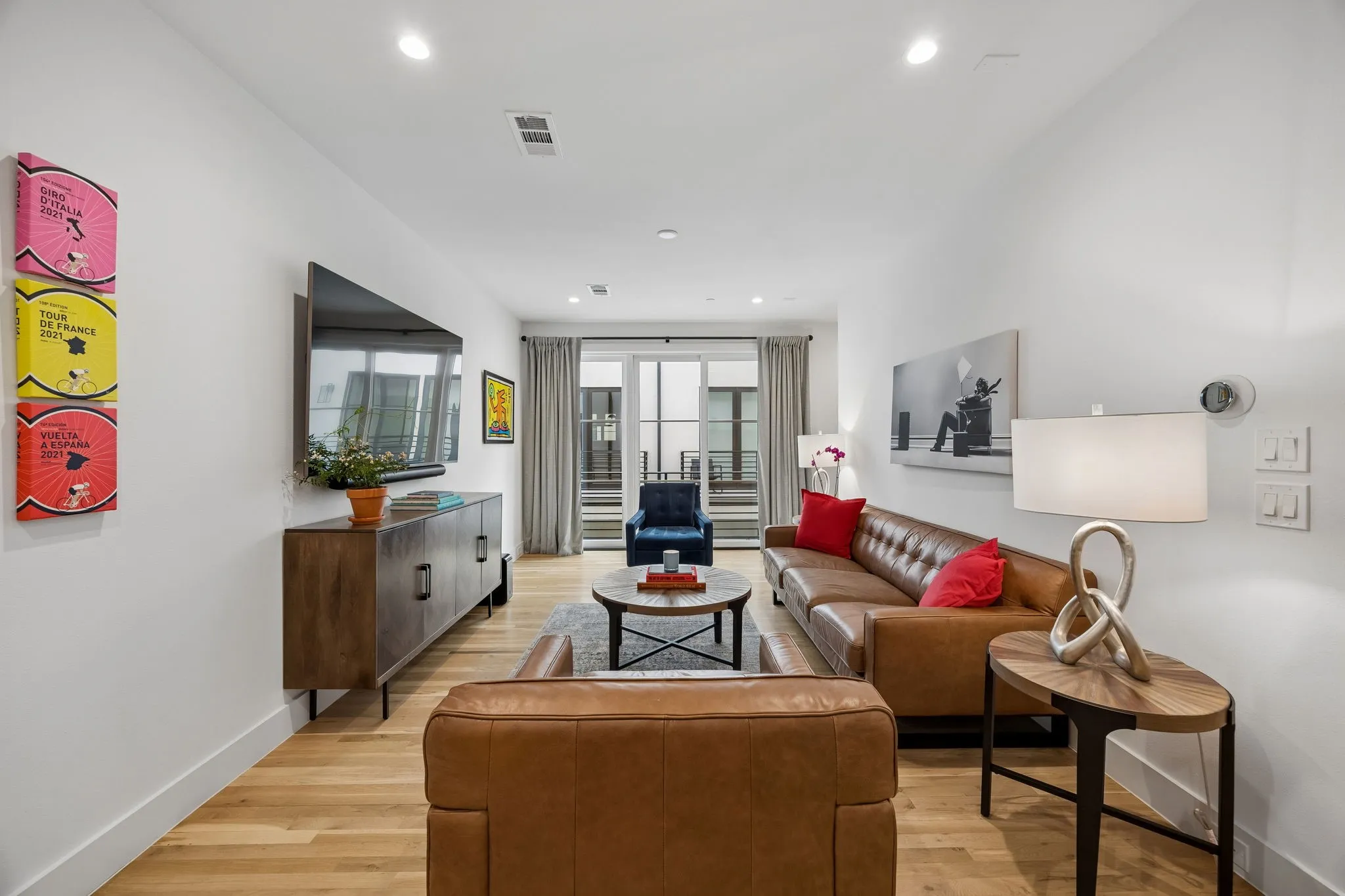 Bright and inviting living area with views to outside green space and a personal balcony.