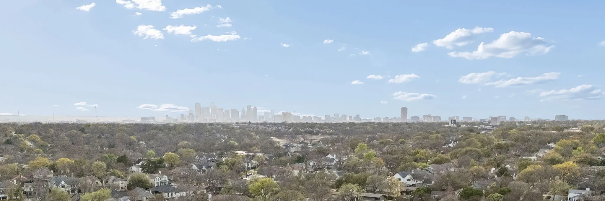View showcasing the natural surroundings with a clear glimpse of the Dallas city skyline.