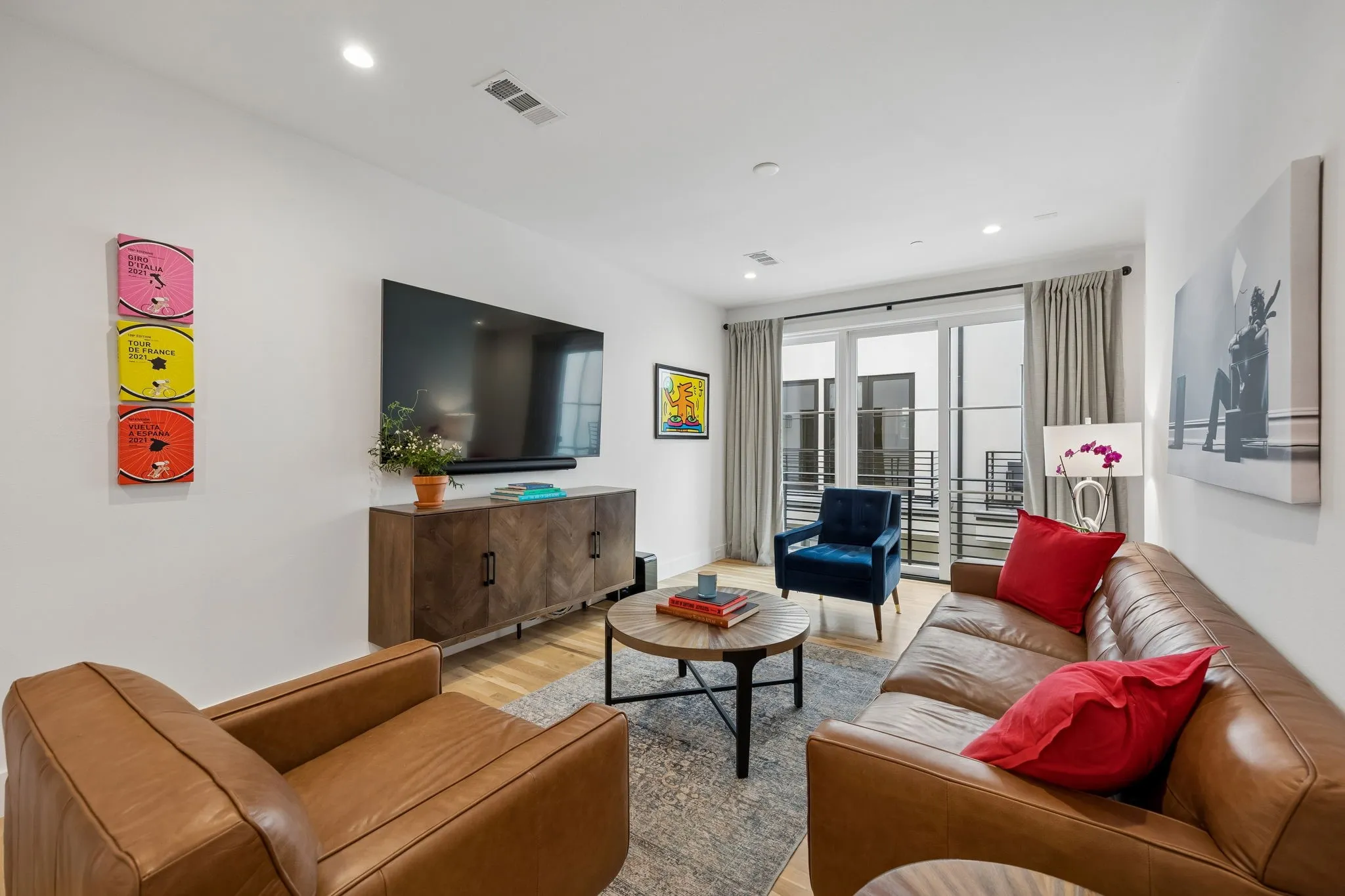 Bright and inviting living area with views to outside green space and a personal balcony.