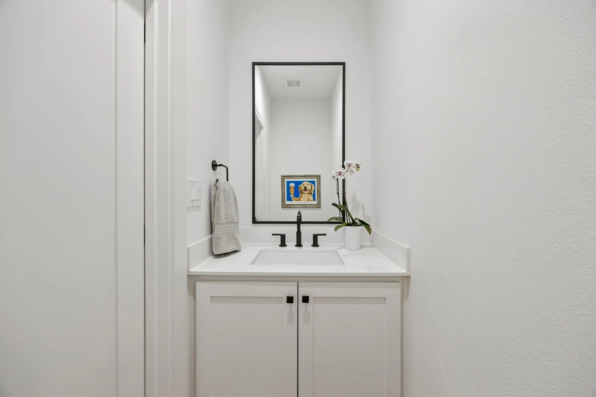 Half bath of living and kitchen area makes perfect for guest while visiting or entertaining
