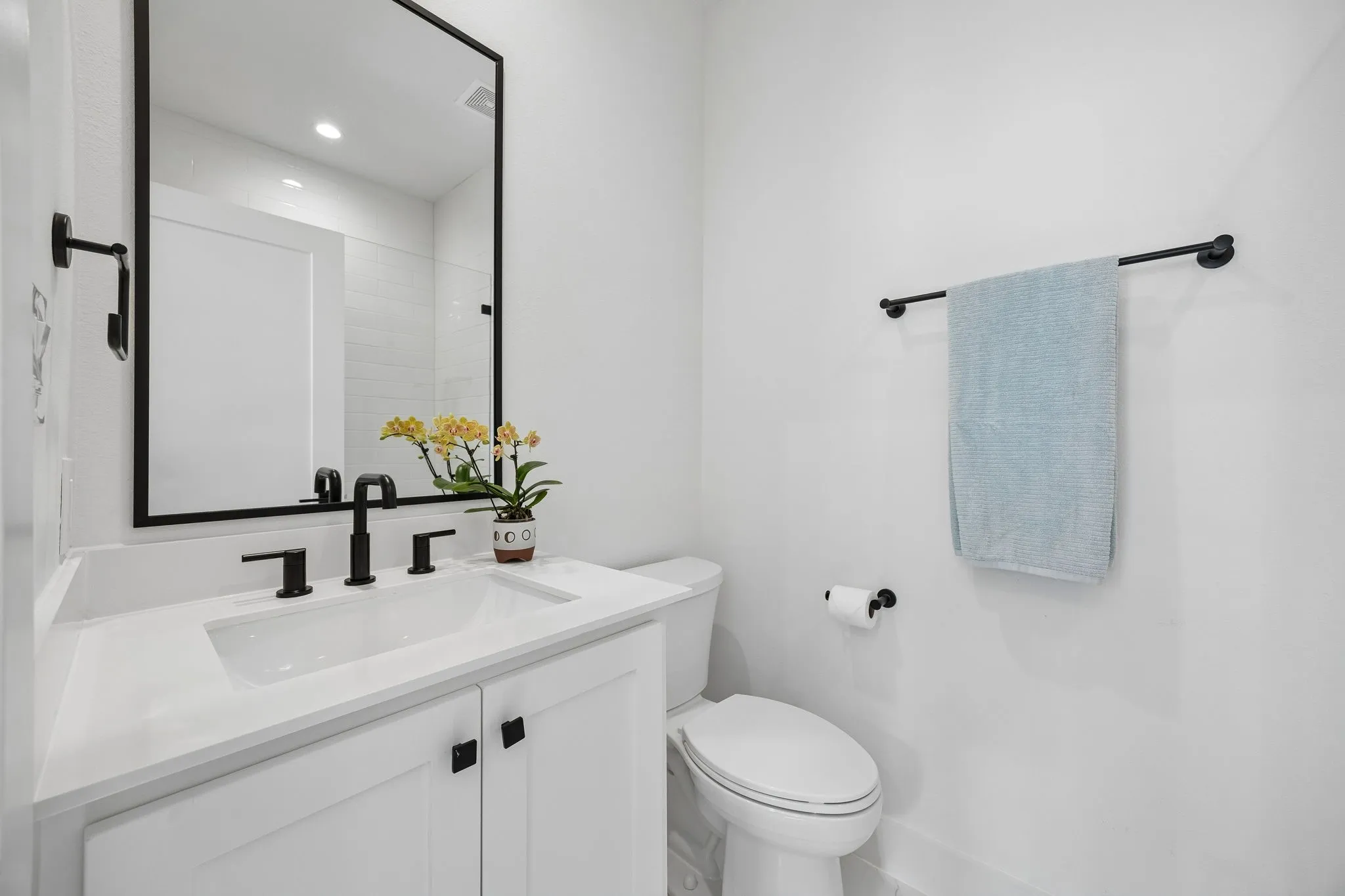 Bathroom with vanity and walk-in shower.