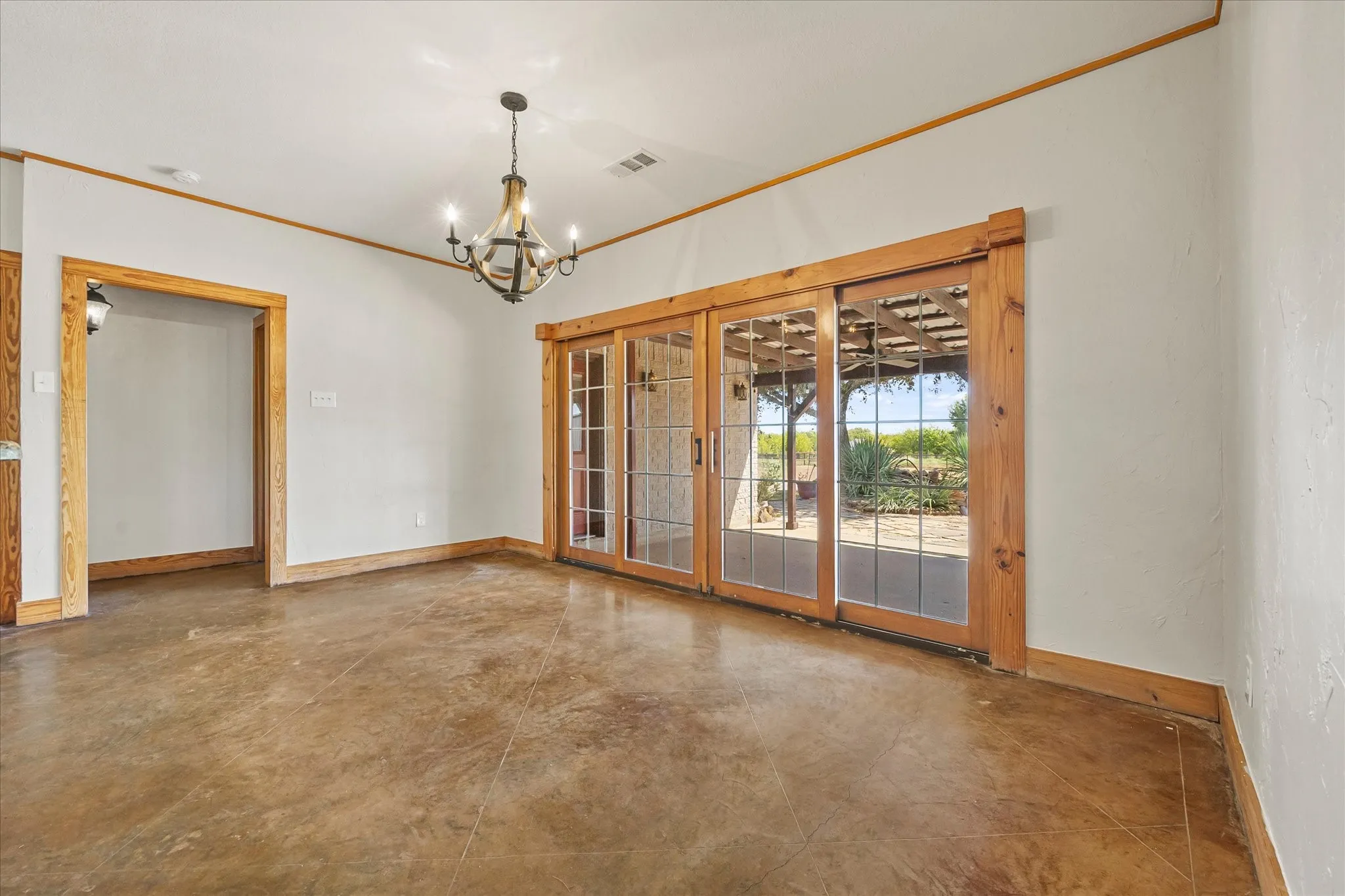 Kitchen and dining room have view of garden, flagstone covered patio, and pastures beyond.