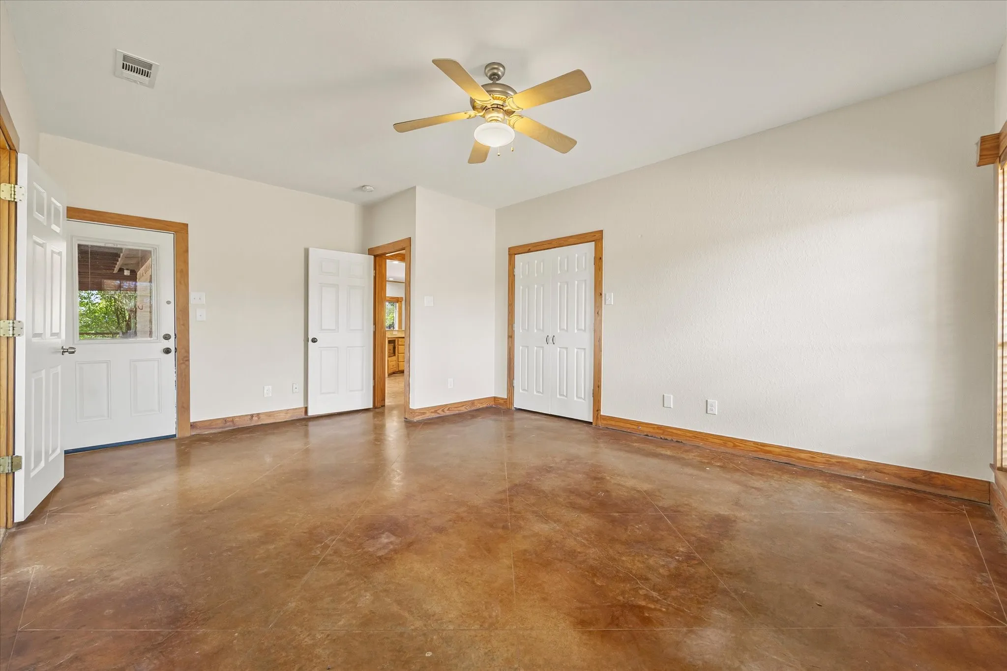 Another view of primary bedroom. Private patio access. Second primary closet.