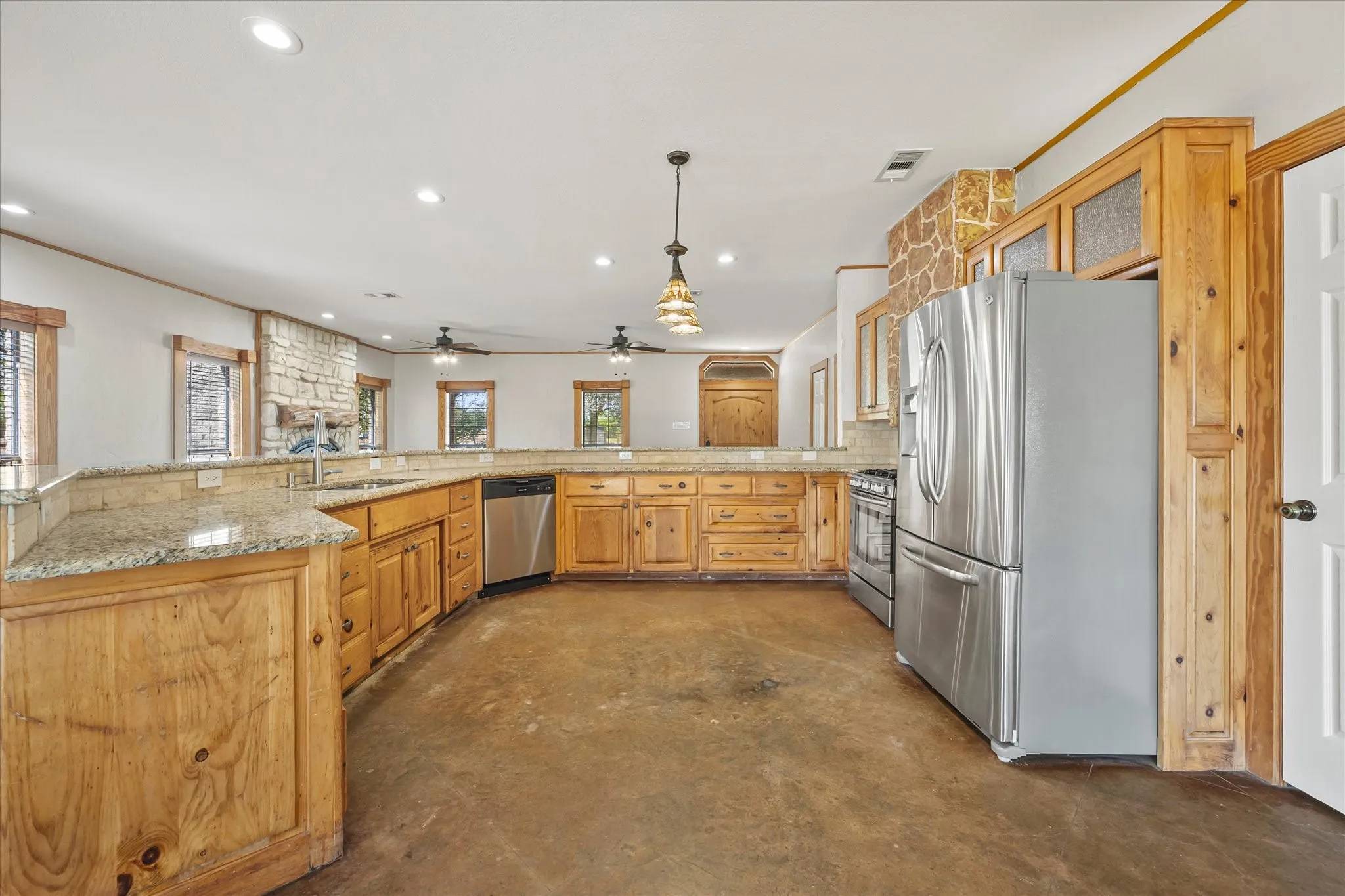 Wrap around breakfast bar provides plenty of room for gathering and conversation.