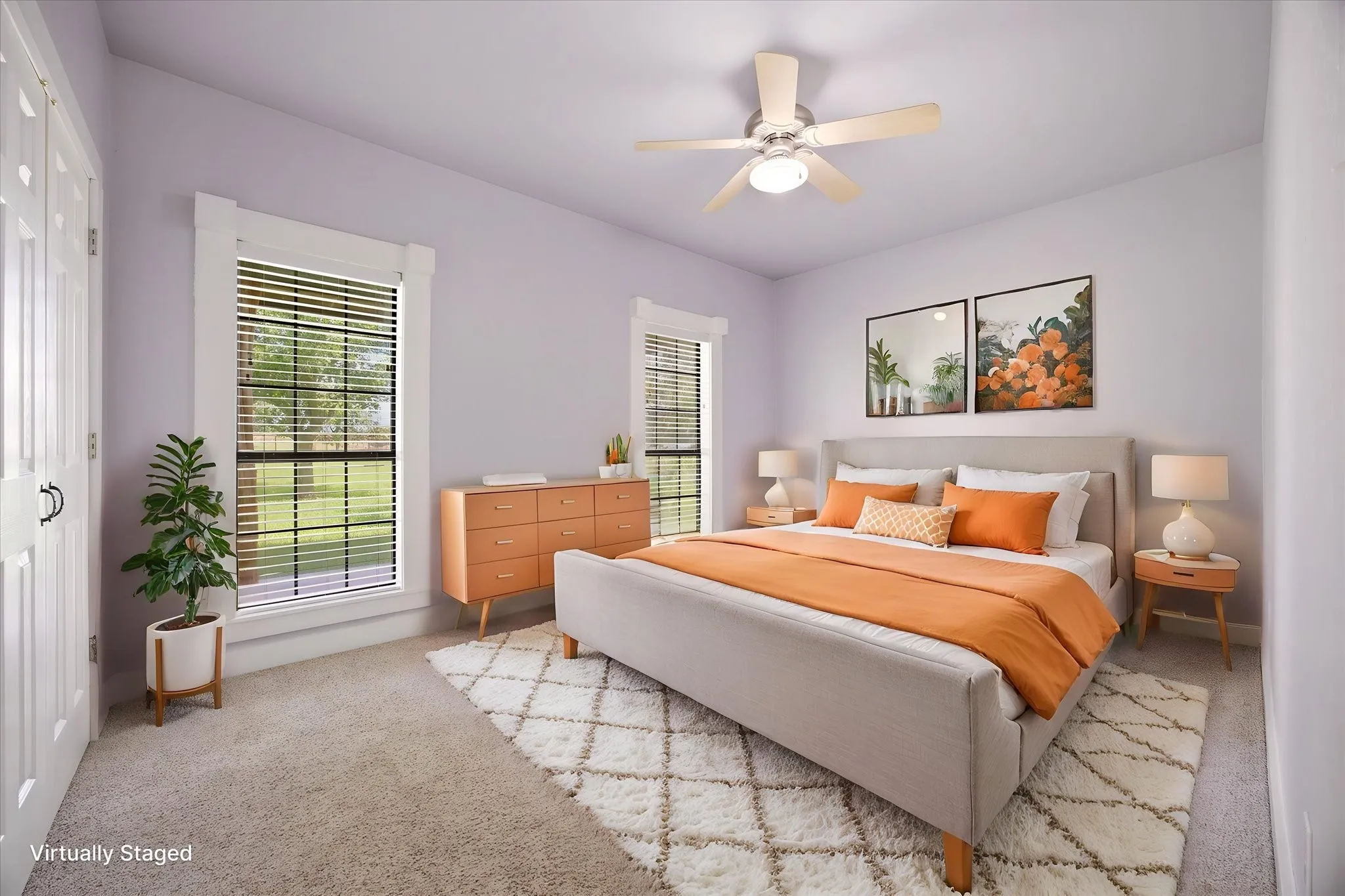 Virtually staged. Front secondary bedroom with view overlooking porch and yard.