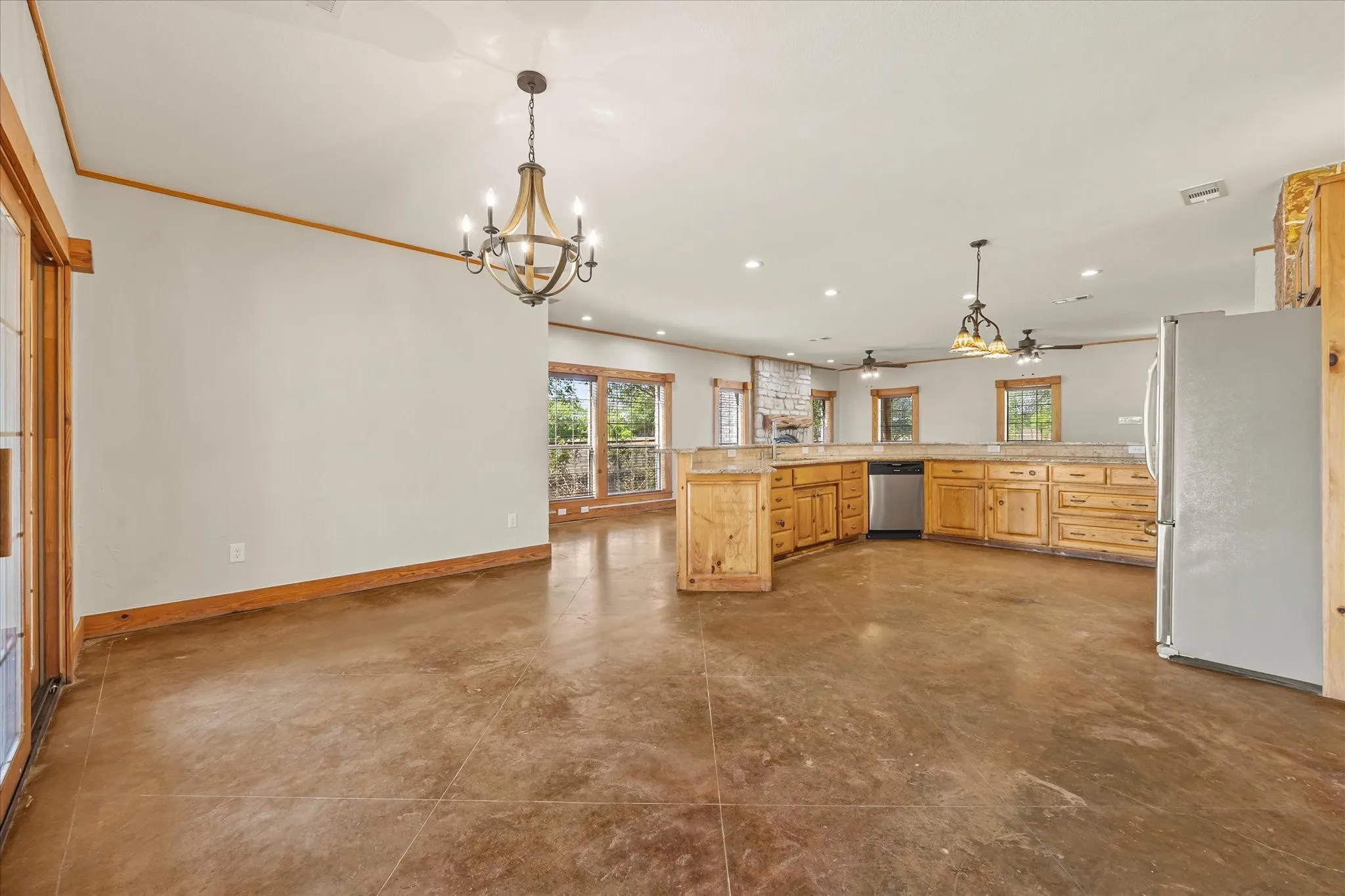 Unstaged dining area, opening to kitchen.