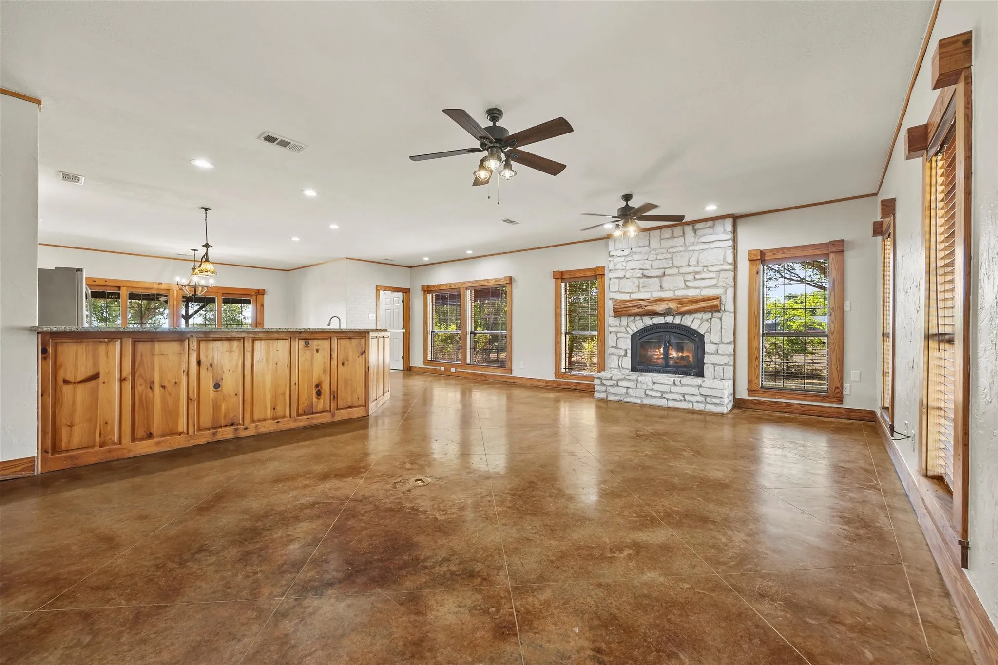 Unstaged living room shows the large open space.