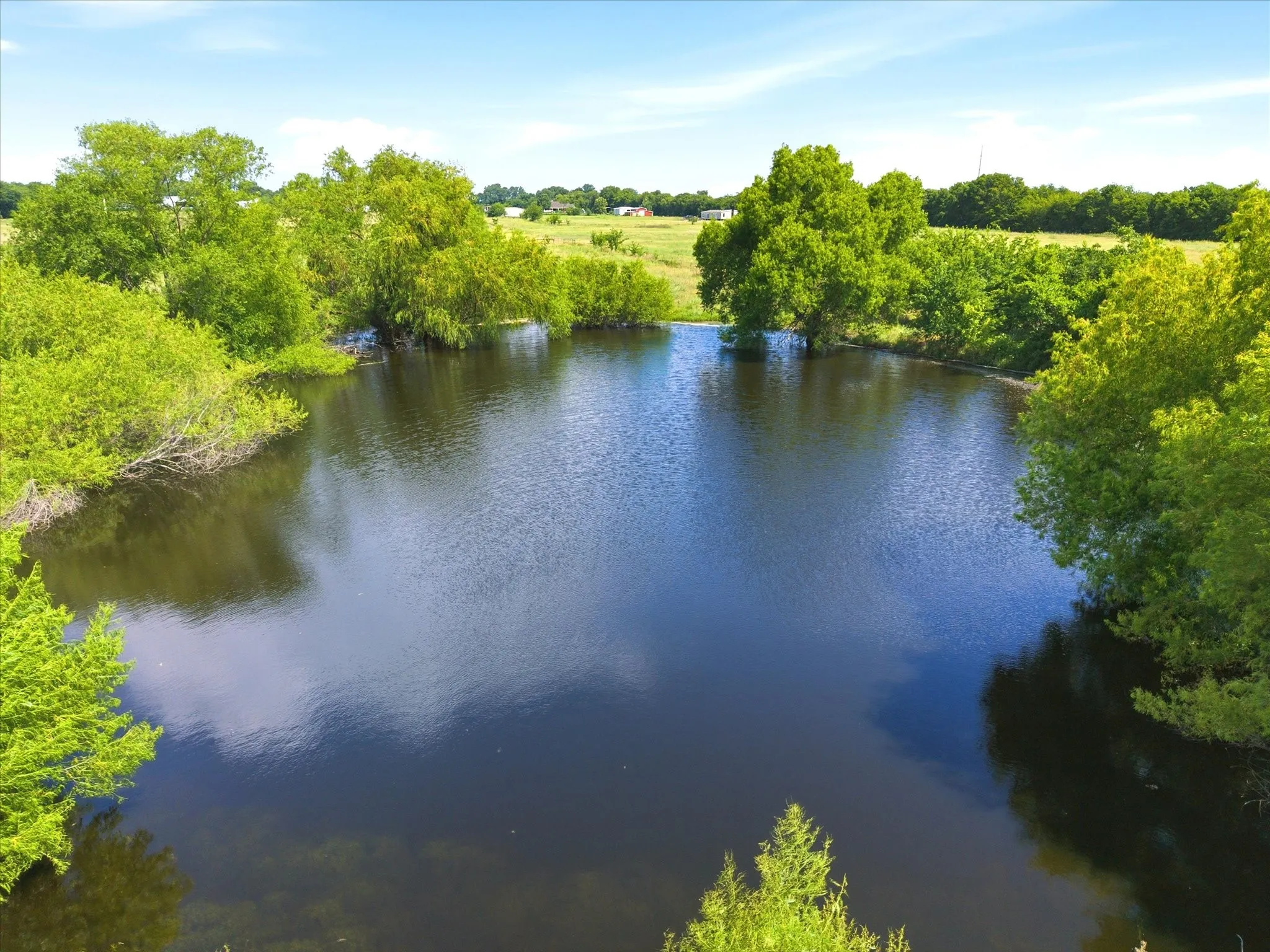 Beautiful stock tank at back of property - go fishing or water your livestock.