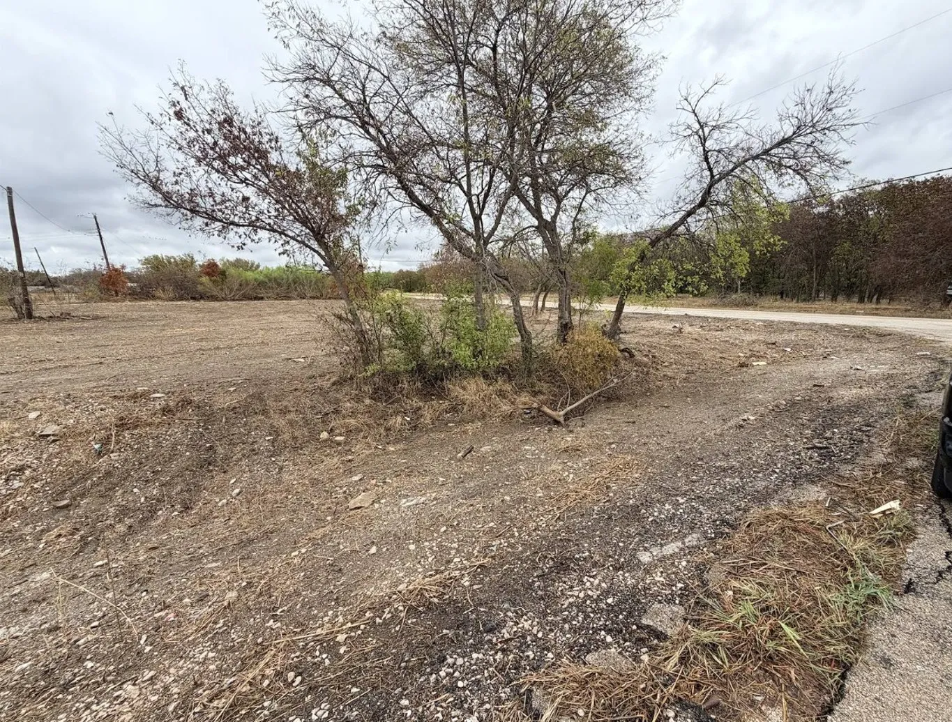 Corner lot at 5374 Pixie Ln featuring open commercial frontage. Zoned PD 101 with dual street access and city utilities available at the street.