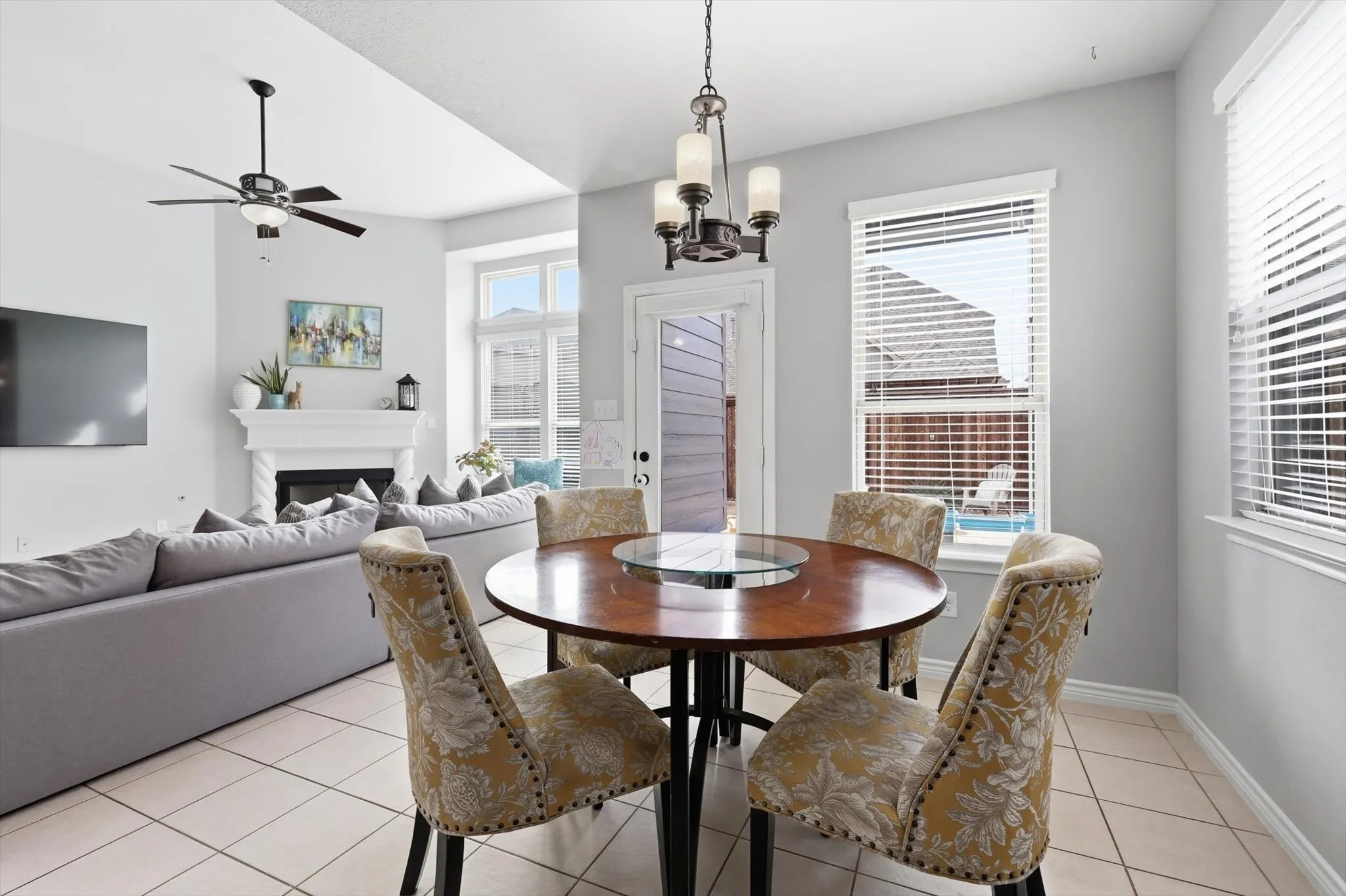 A spacious informal dining area with a surround of windows.
