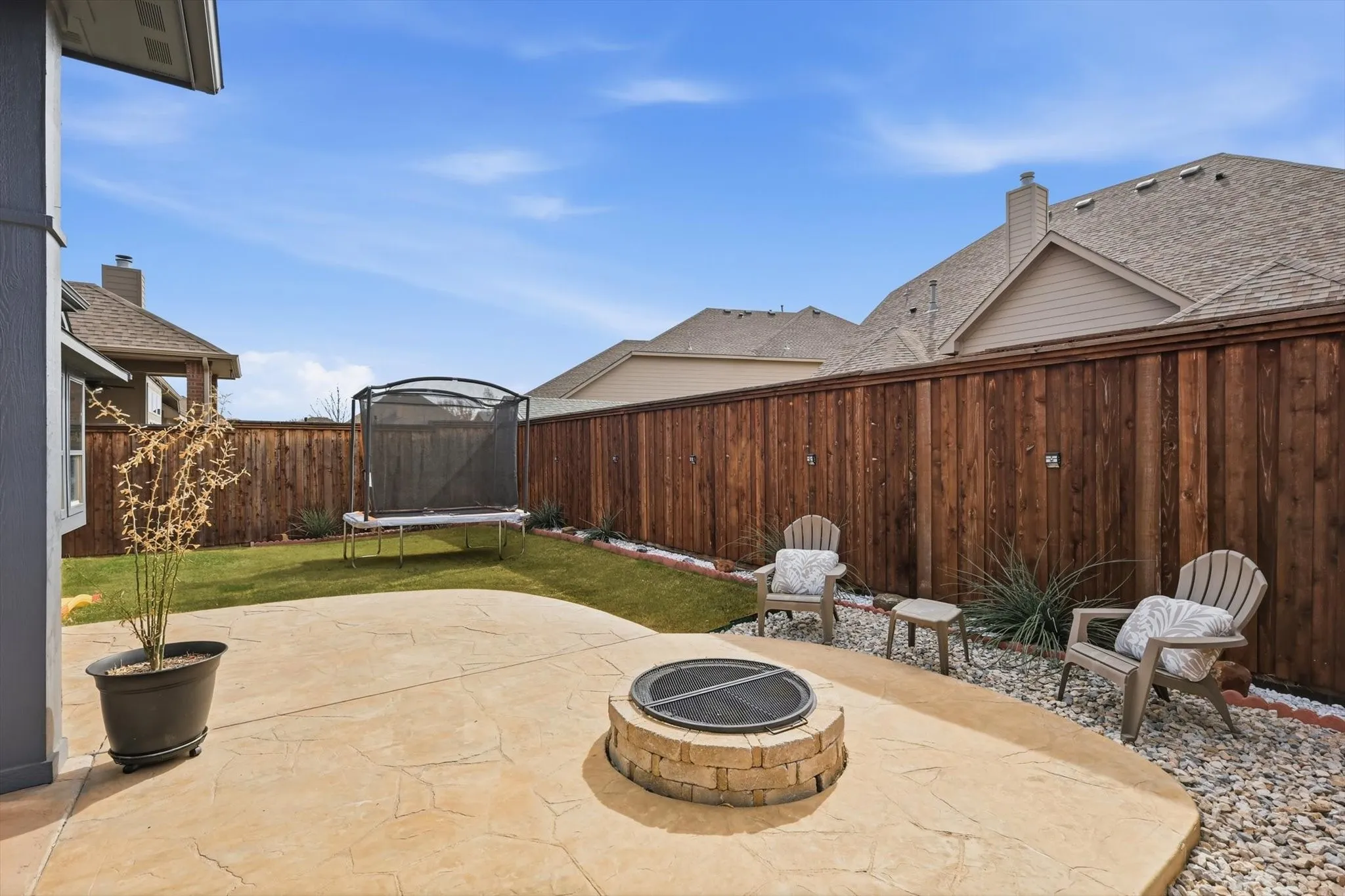 Complete with firepit and grass play area and low maintenance riverrock