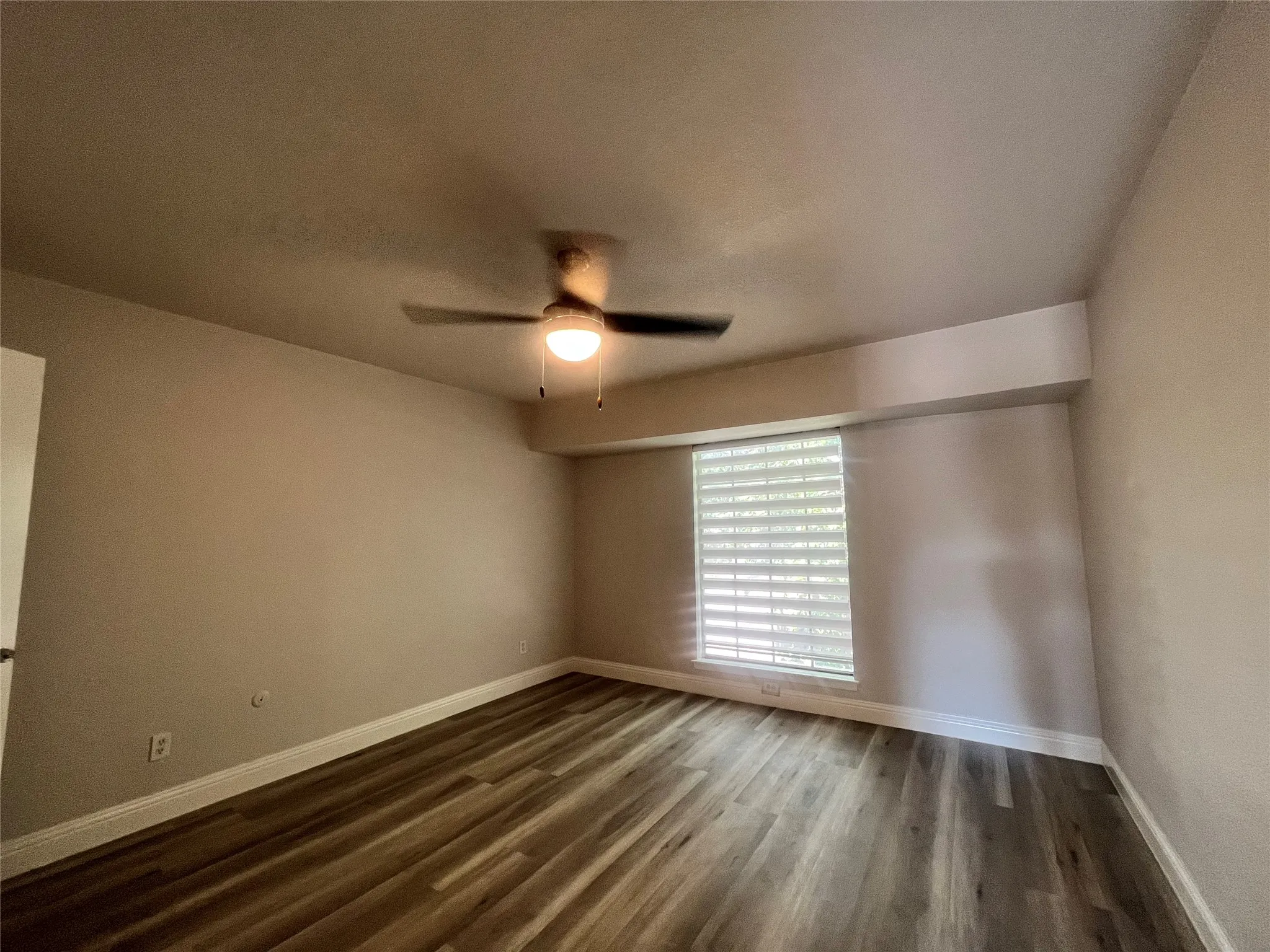 Wood-finish flooring with crisp white trim