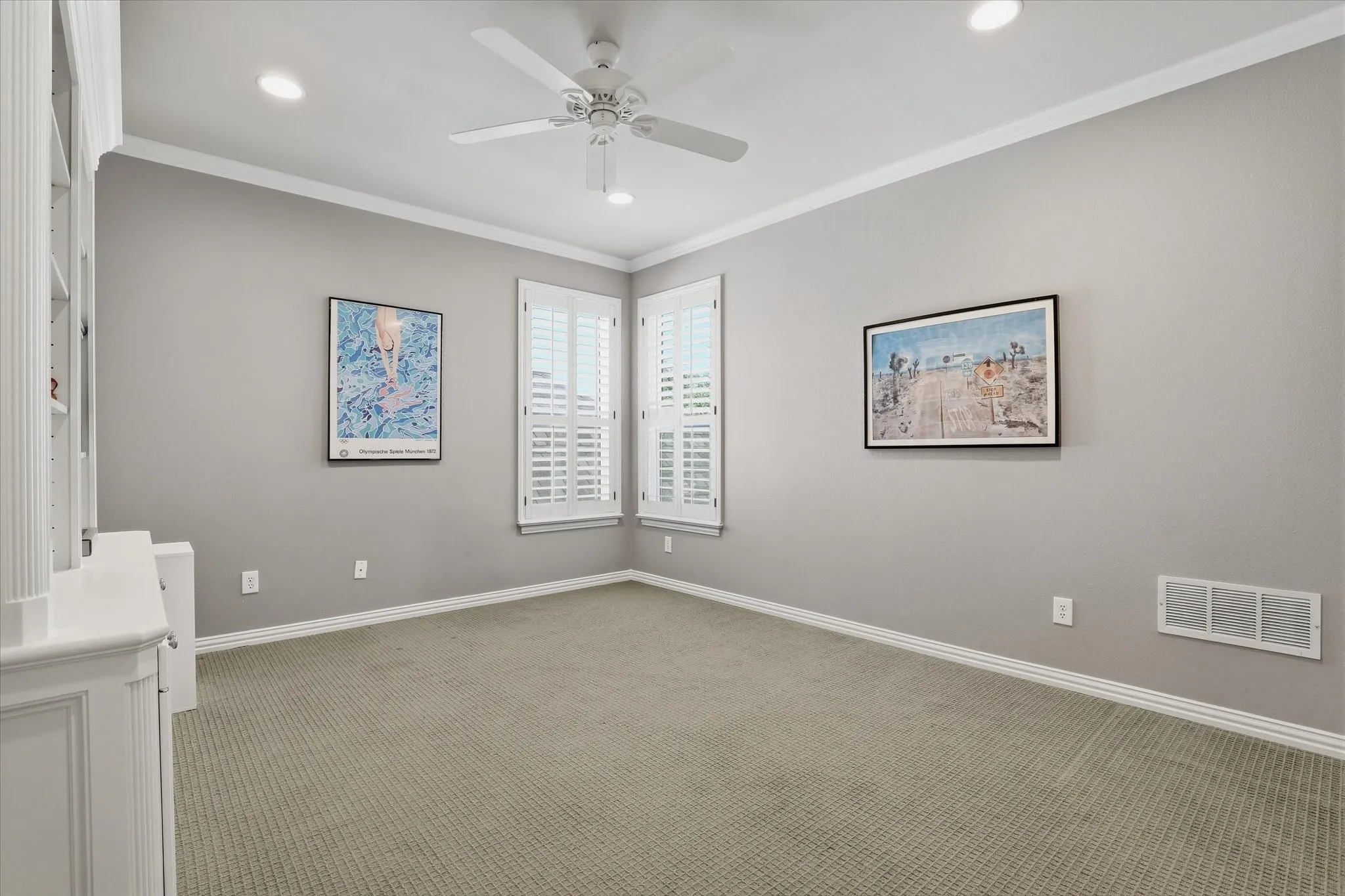 Second upstairs bedroom with built-in cabinetry offers flexibility to be an office.