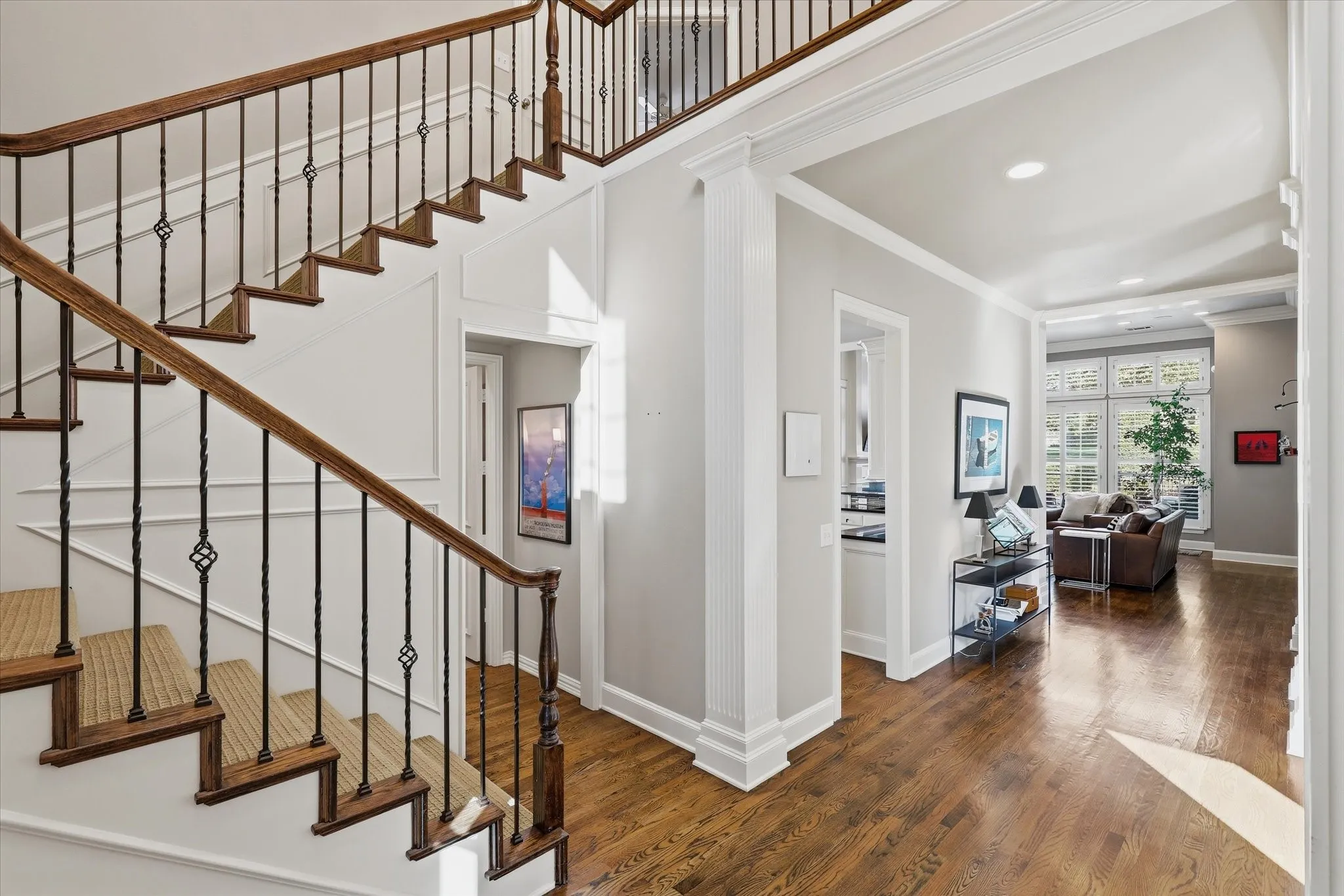 Inside, a refined neutral palette, crisp white millwork, hardwood floors and high ceilings give the home timeless character and a welcoming feel.