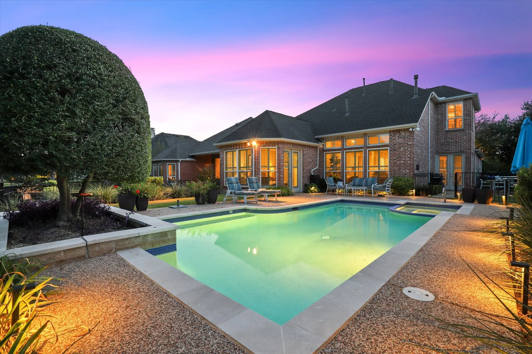 Outside, landscaped gardens surround the pool and spa, with ample patio room for dining, lounging and gathering with friends and family.