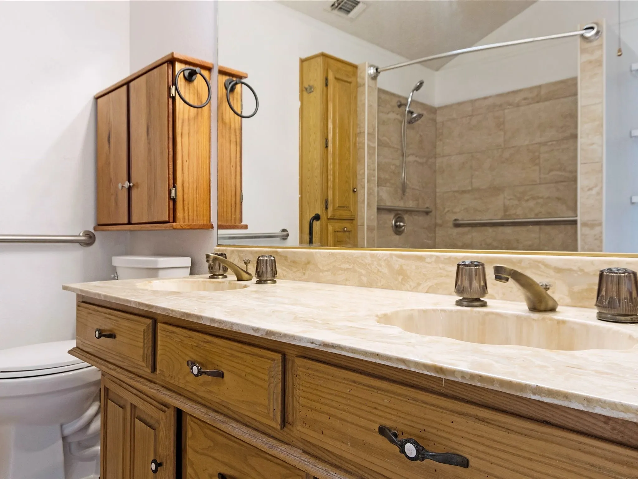 Dual vanity with integrated sinks and a stone-finish countertop