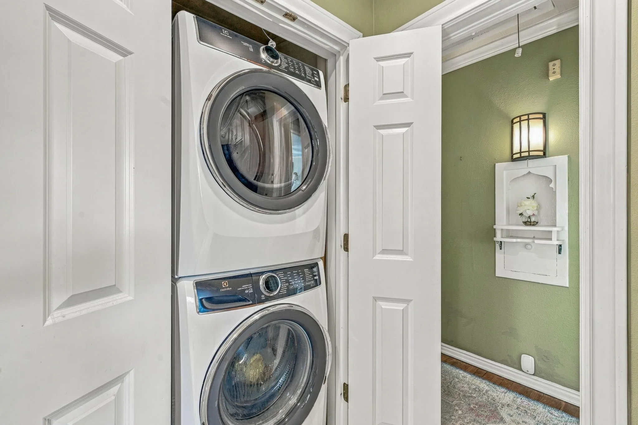 Laundry closet located in kitchen.