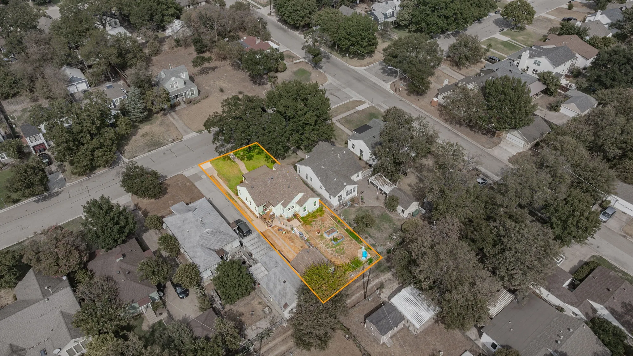 Aerial view of home with estimated property lines.