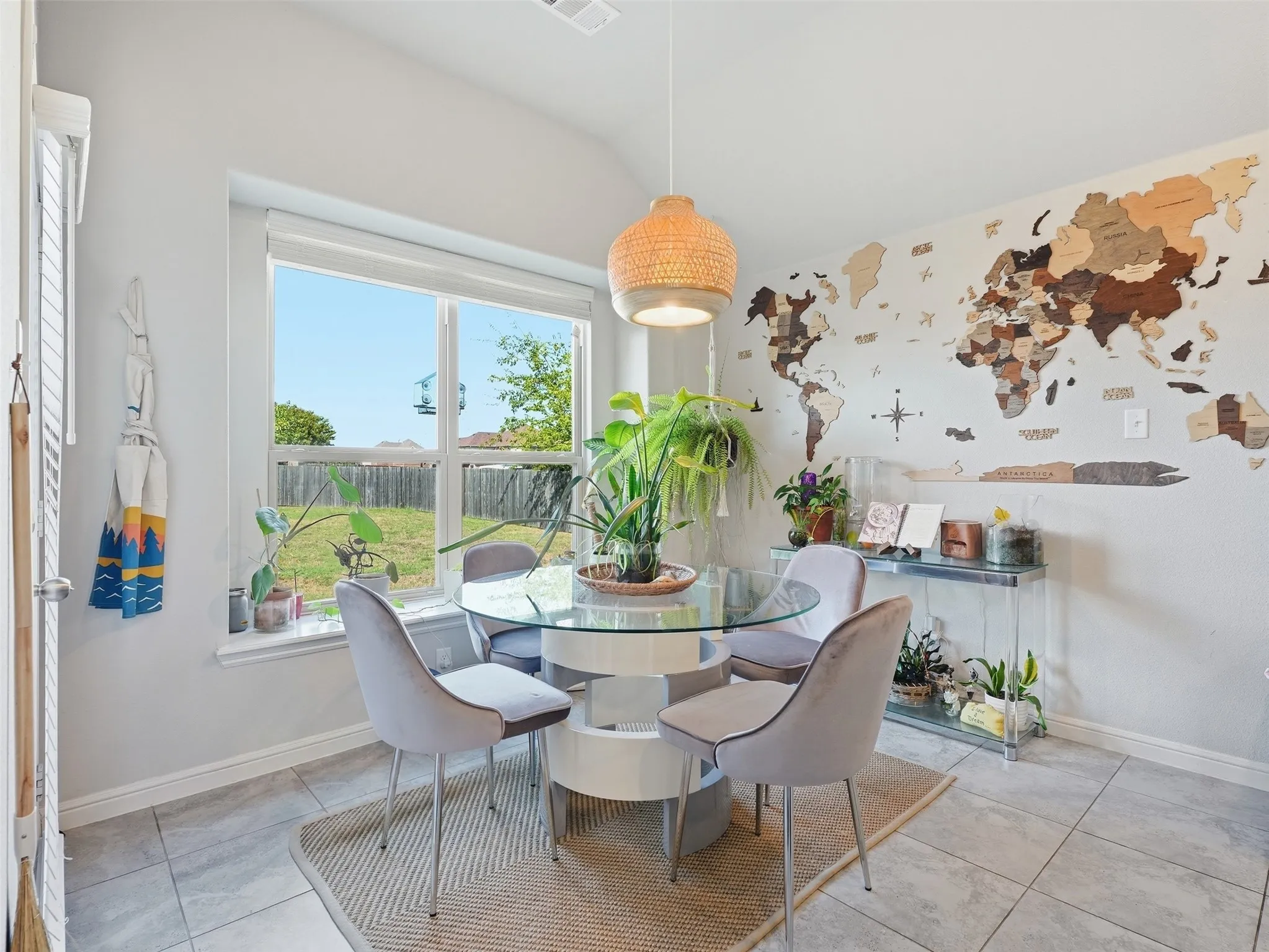 Tile flooring, recessed lighting, and a large window