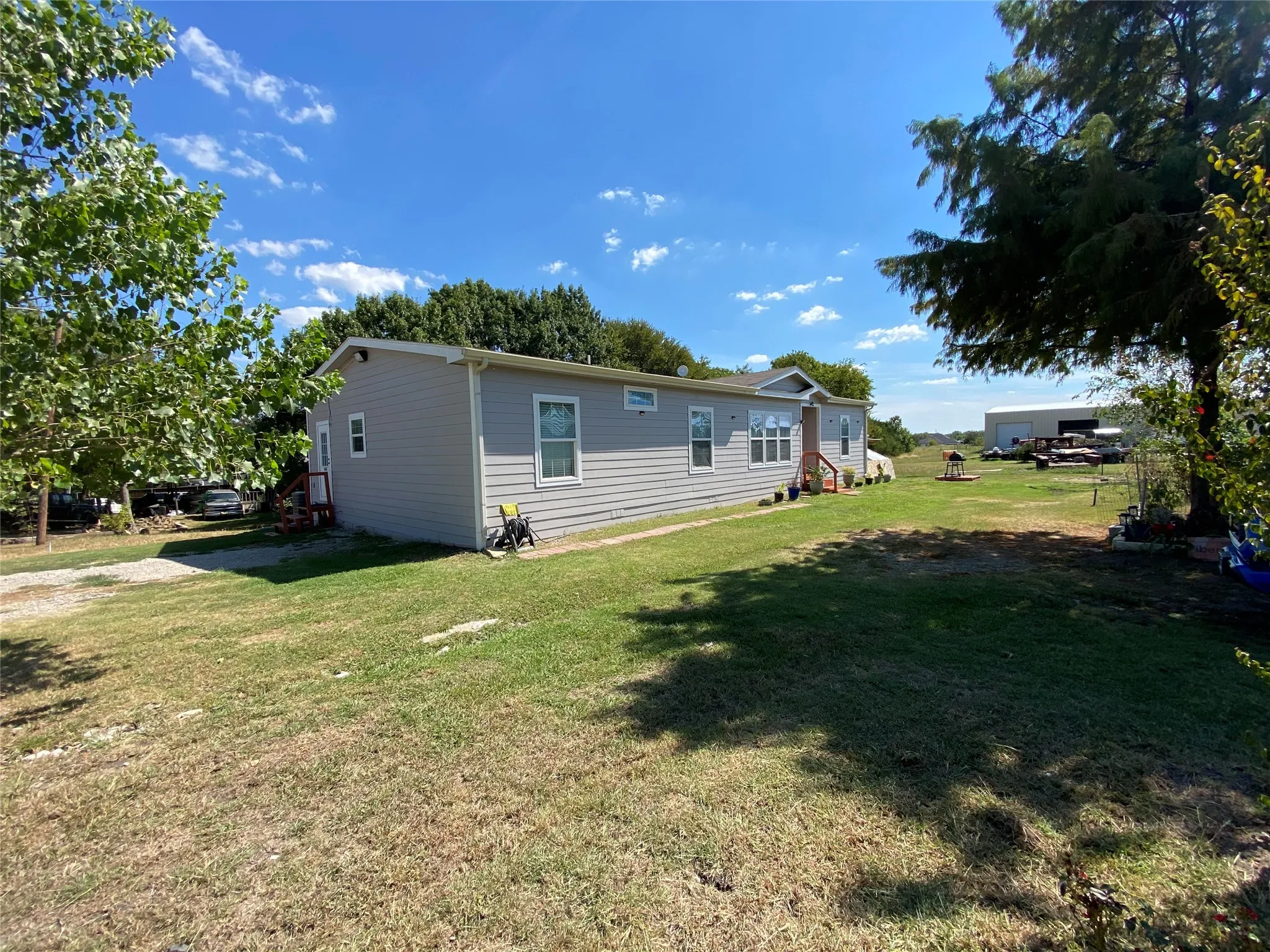 Rear view of property featuring a yard