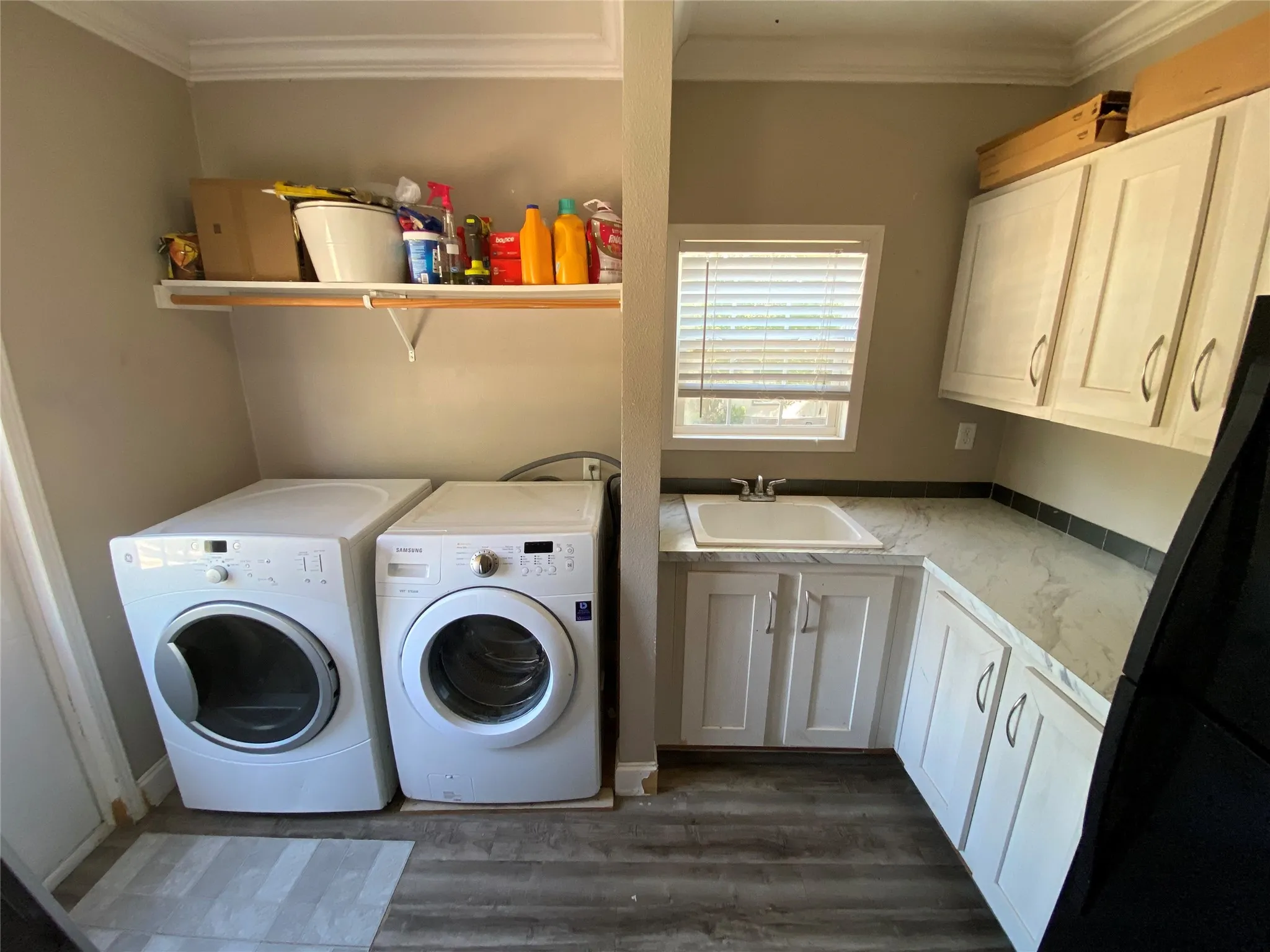 Laundry room with an additional sink