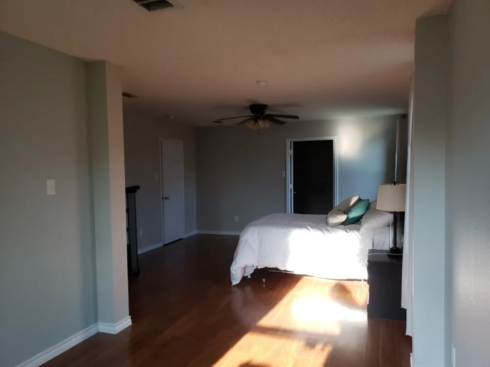 Recessed ceiling lighting, wood-finish flooring, ceiling fan, and white trim