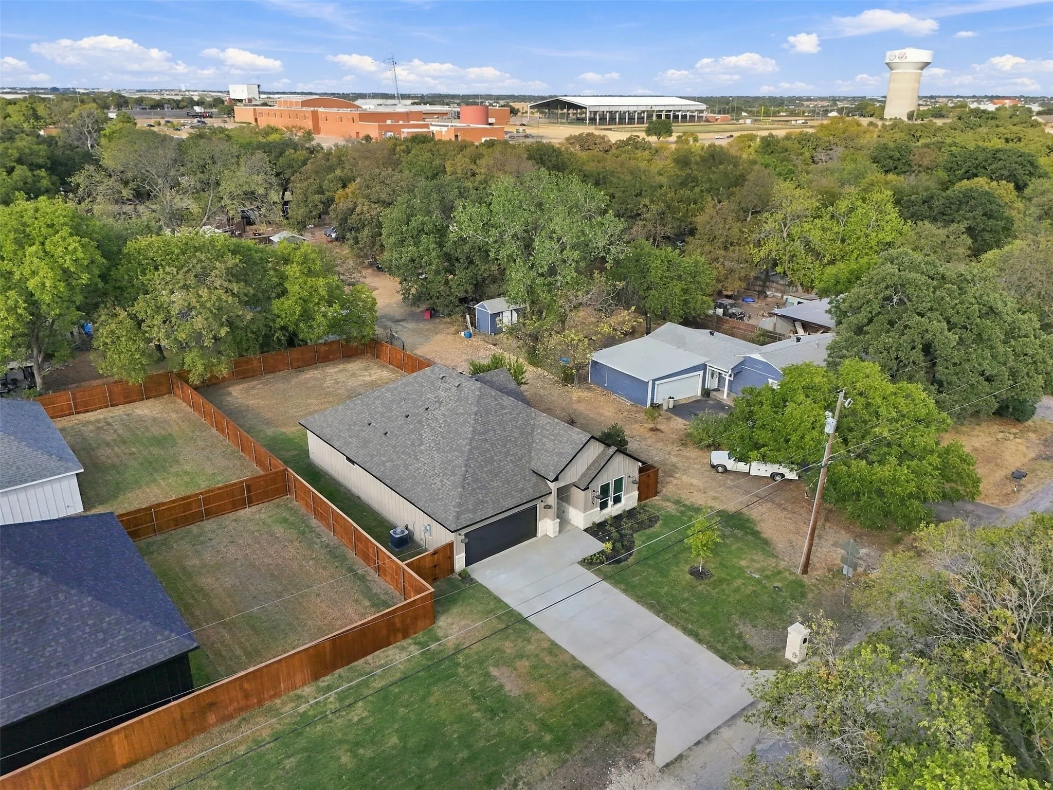 Single-story residence featuring a gray shingle roof and an attached two-car garage