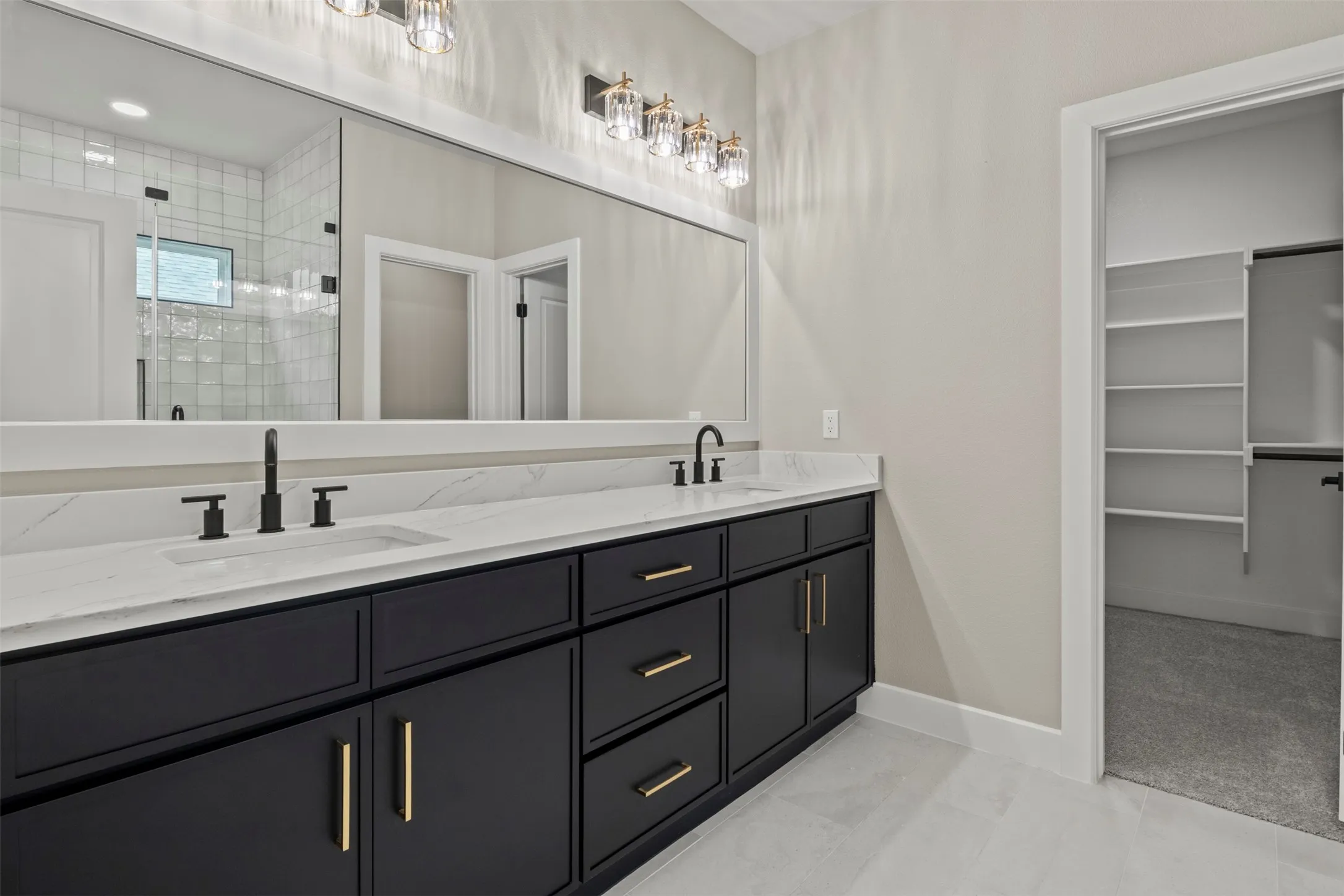 Dual vanity with a white countertop and undermount sinks