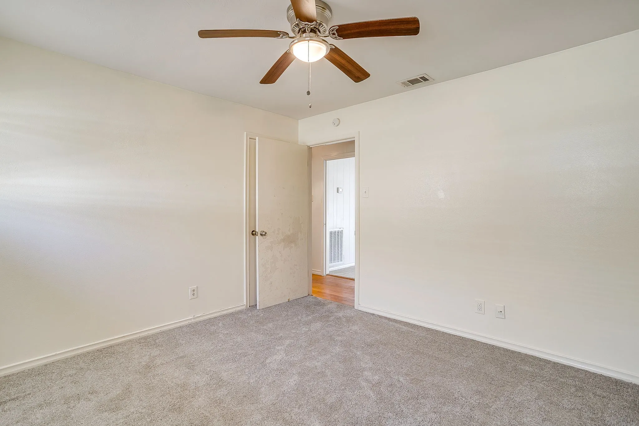 Guest bedroom #2 Recessed lighting fixture with a ceiling fan, light-toned carpeting, and a white interior door
