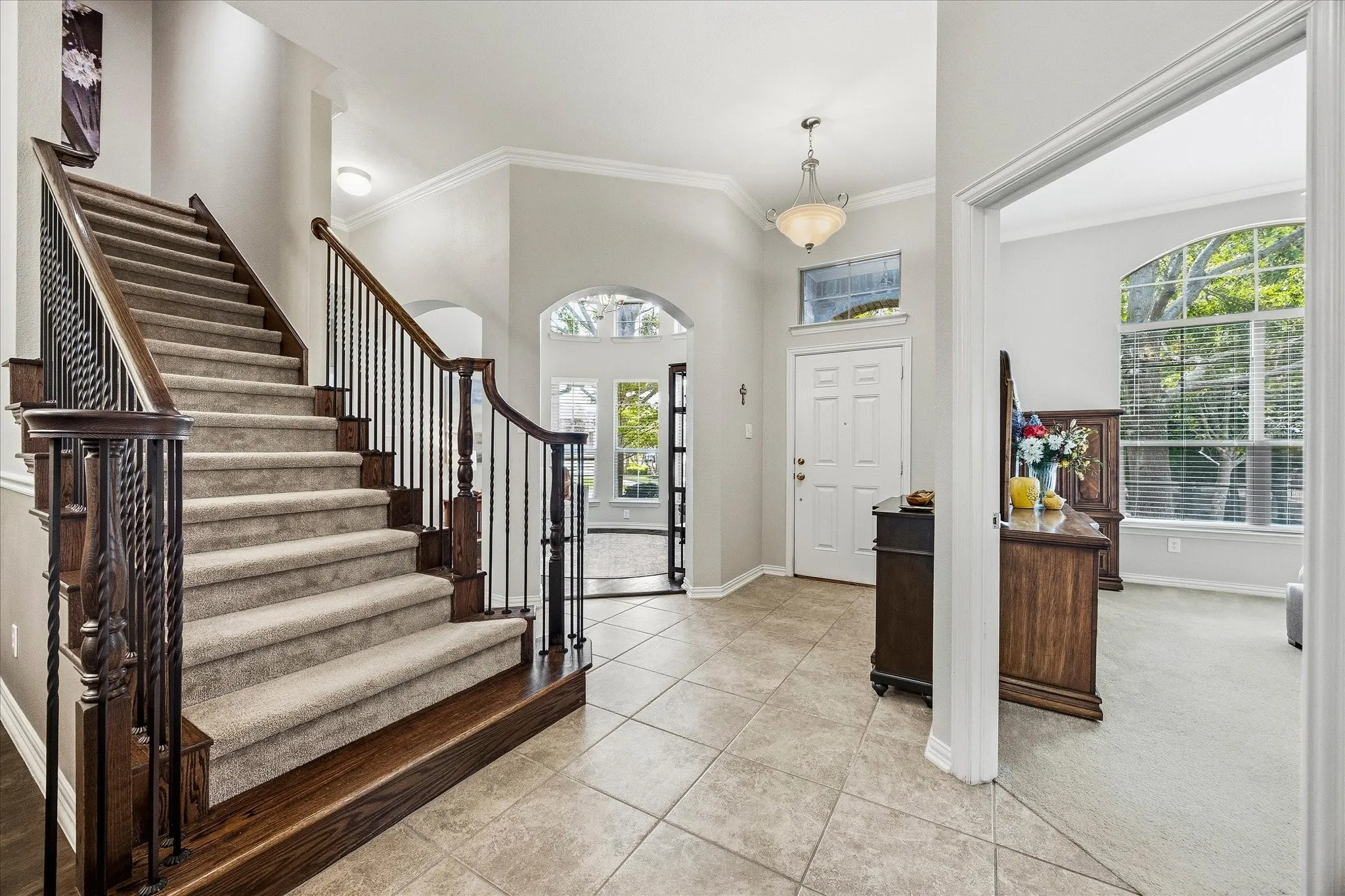 Majestic staircase, high ceilings,& arched doorways adorn this incredible home!