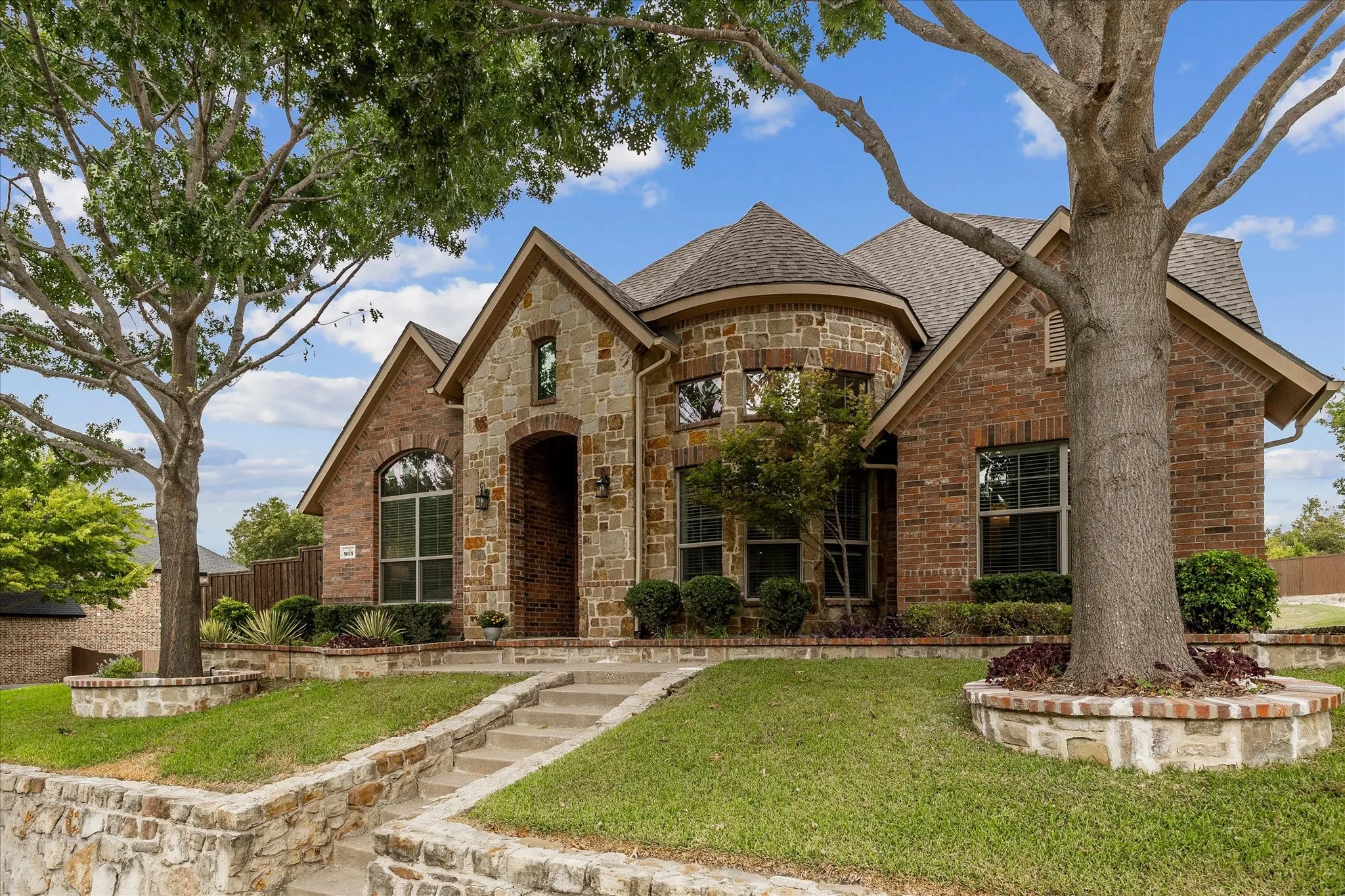 Lushly landscaped lawn is only a preview of this home's many amenities!